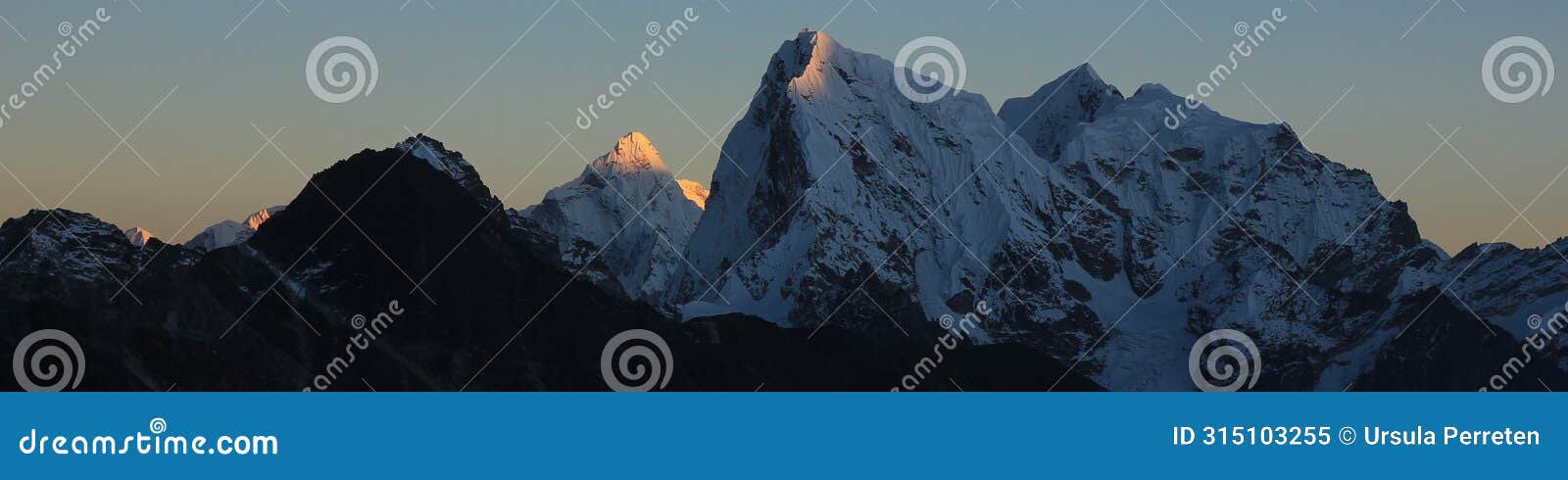 sun lit mountain peaks of ama dablam and cholatse at sunset