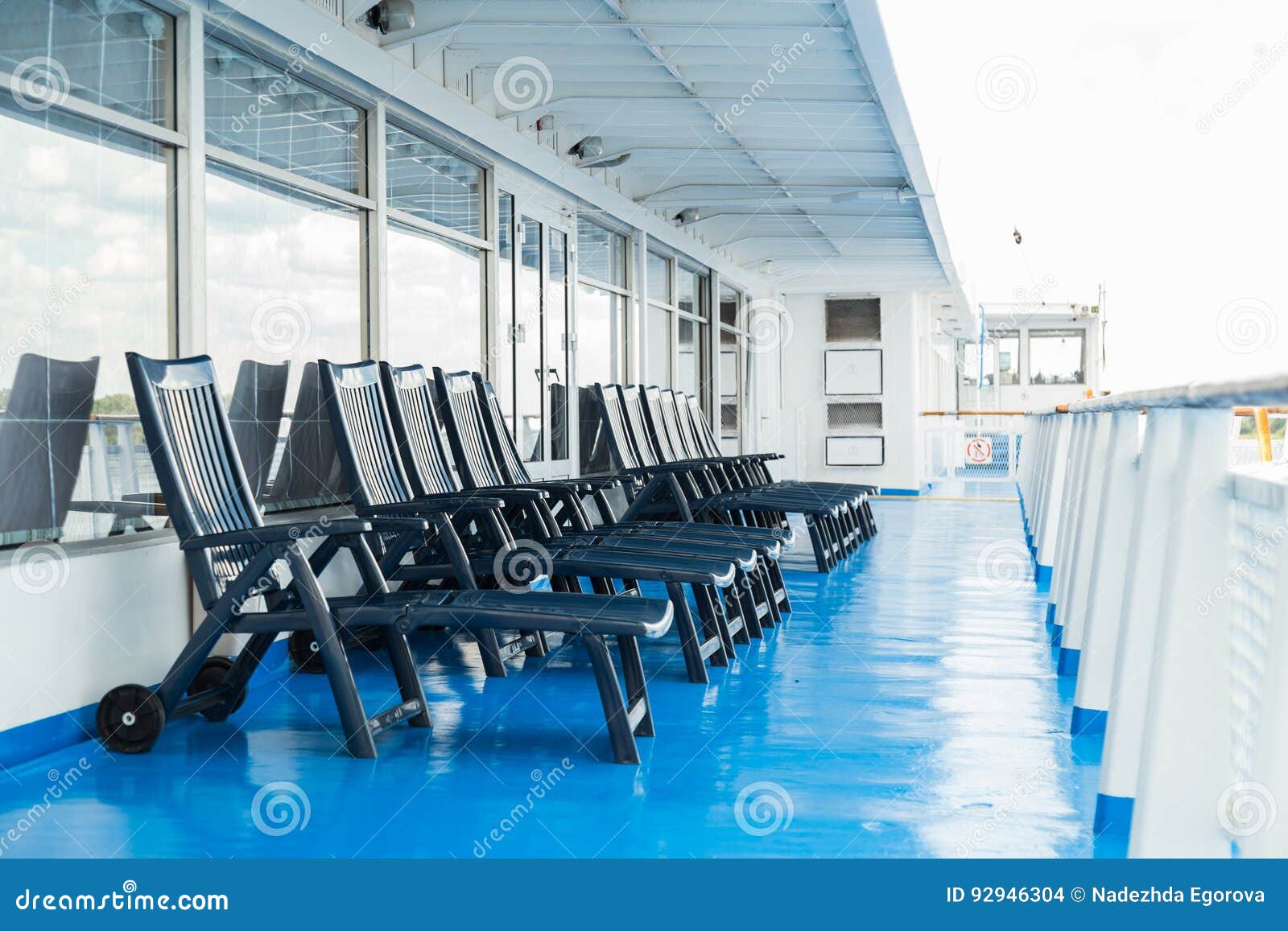Sun loungers on deck stock photo. Image of journey, island 92946304
