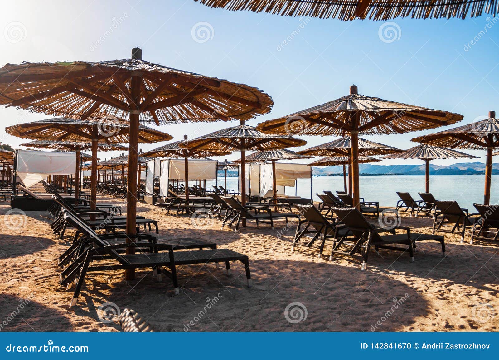 Sun Loungers and Parasols on the Sandy Beach Stock Photo - Image of ...