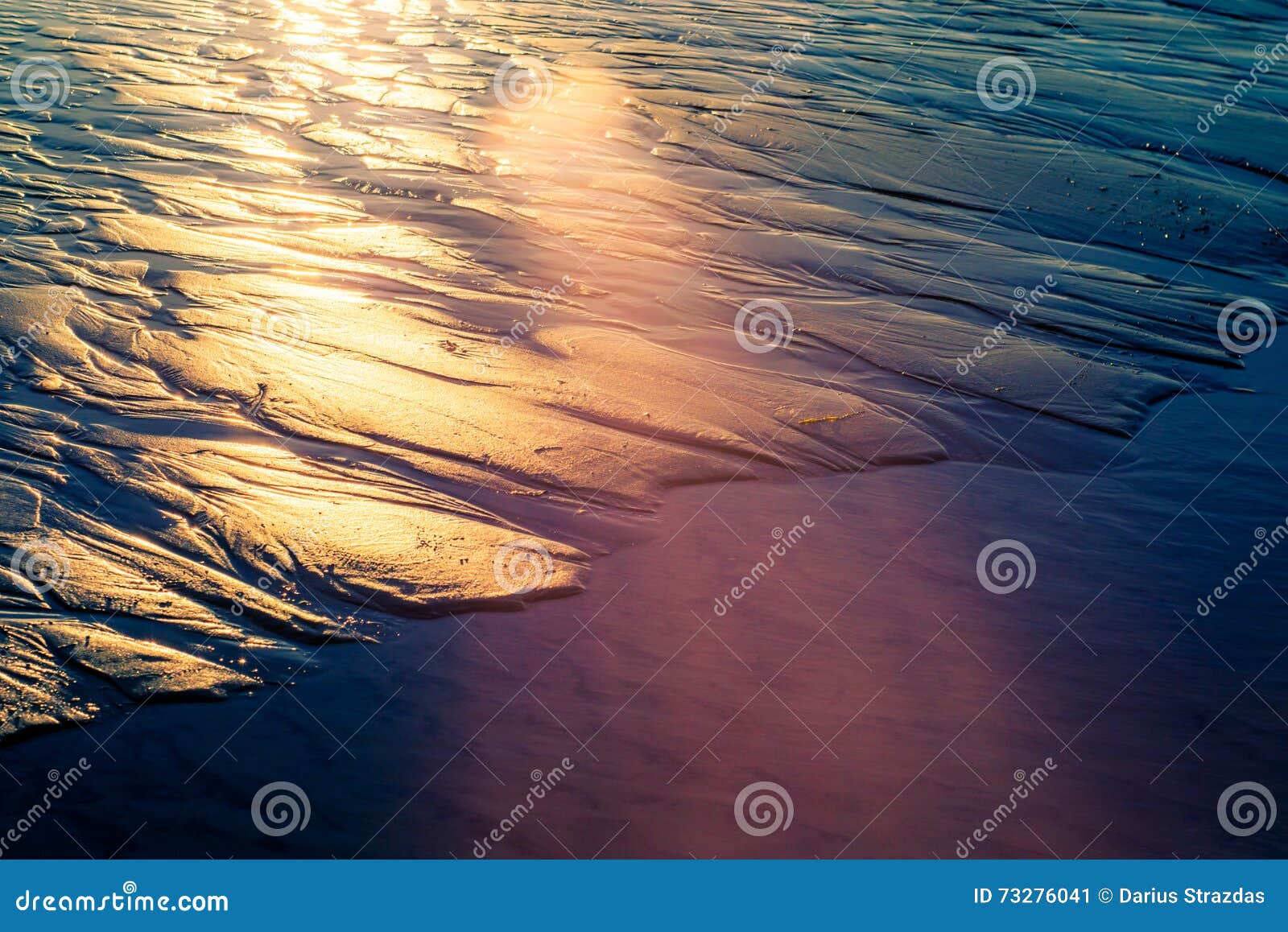 sun patterns wet sand