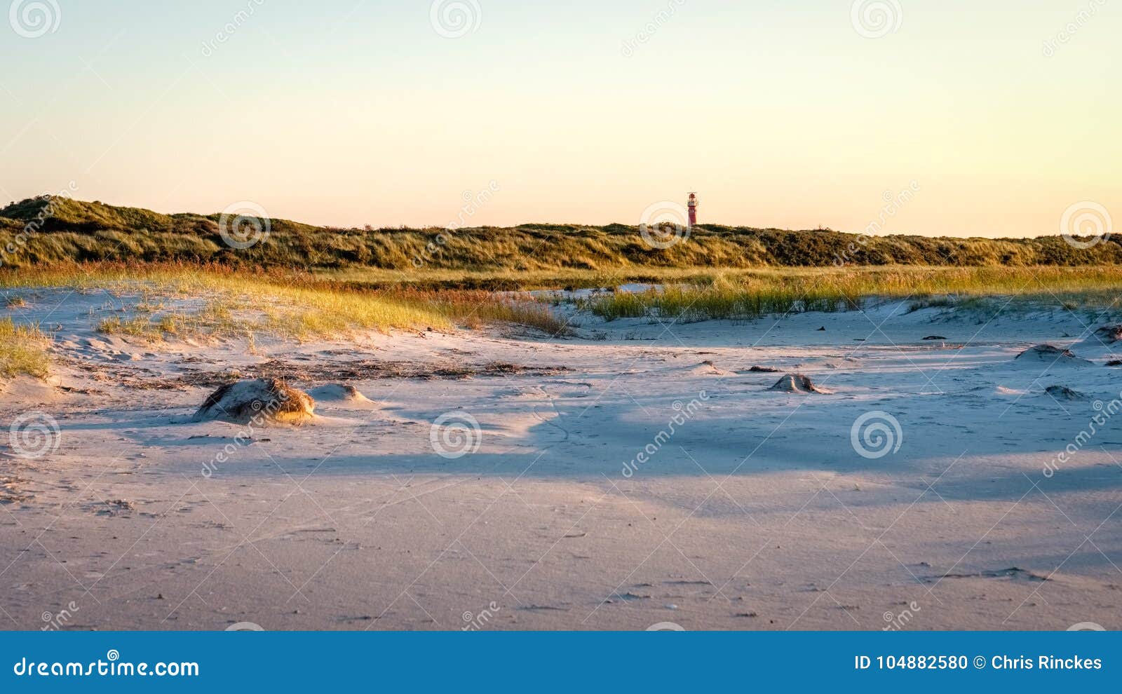 the sun is setting on the beach of schiermonnikoog friesland, netherlands
