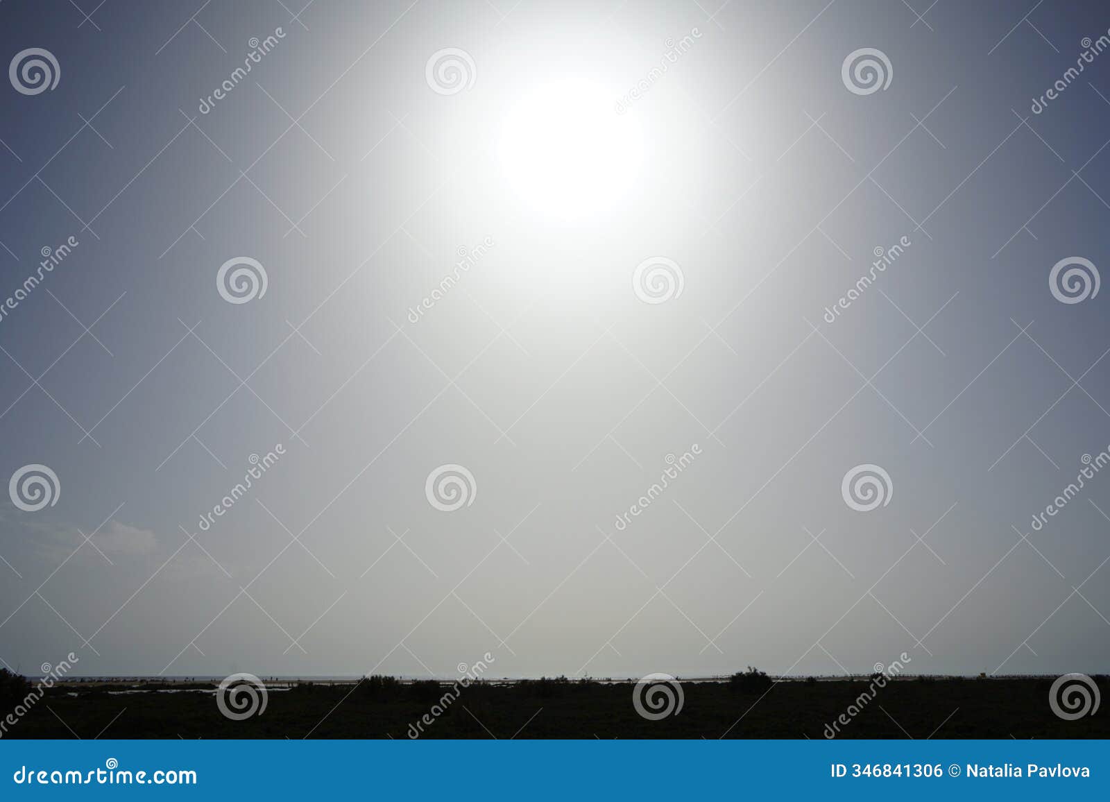 the sun shines over the atlantic ocean, playa de jandia beach and the protected area in october. solana matorral, spain.