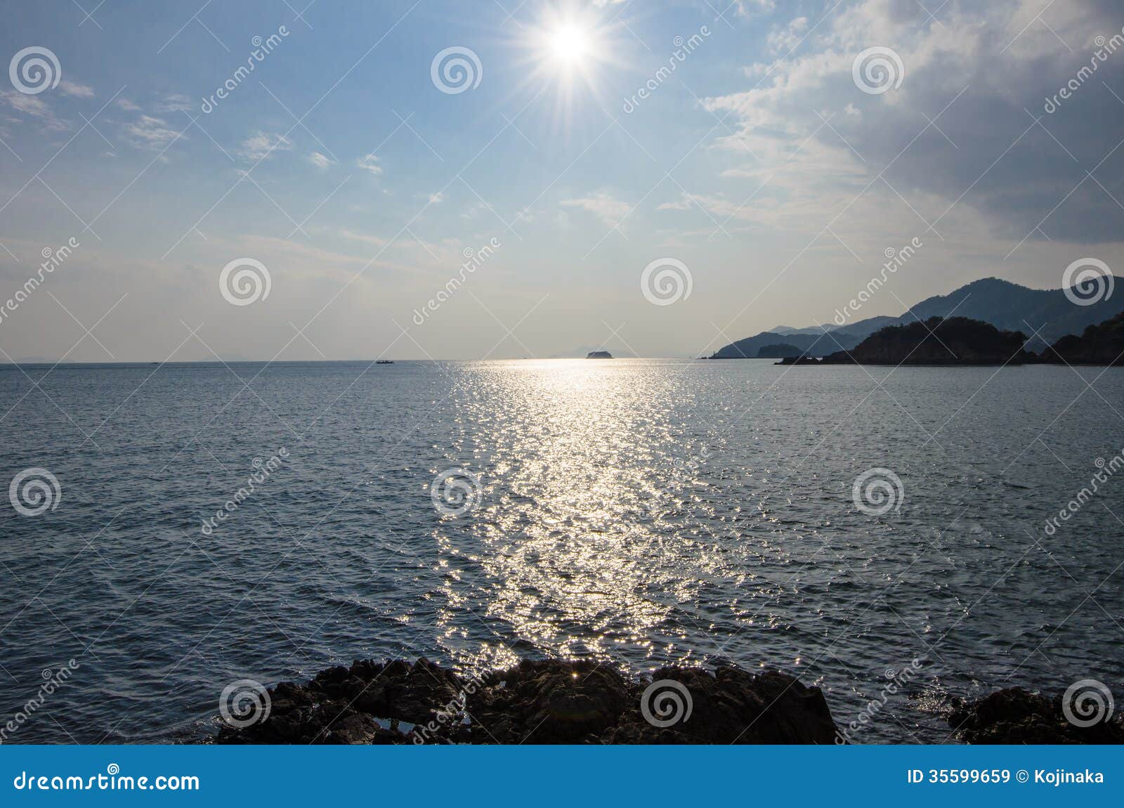 the sun shining on the seto inland sea.