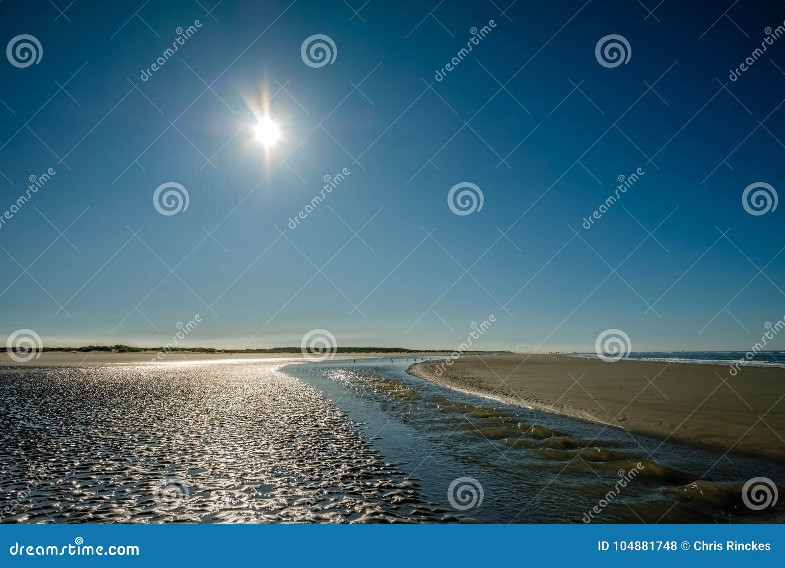 sun is slowly setting along the schiermonnikoog summer coastline netherlands