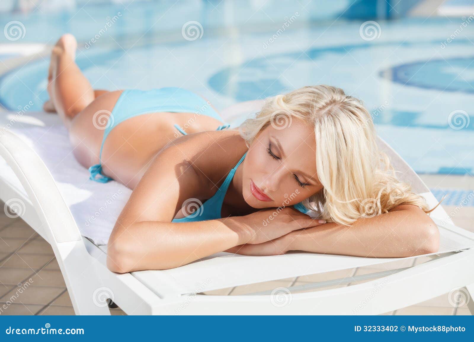 Sun Tanning Beautiful Young Women In Bikini Lying On The Deck C Stock