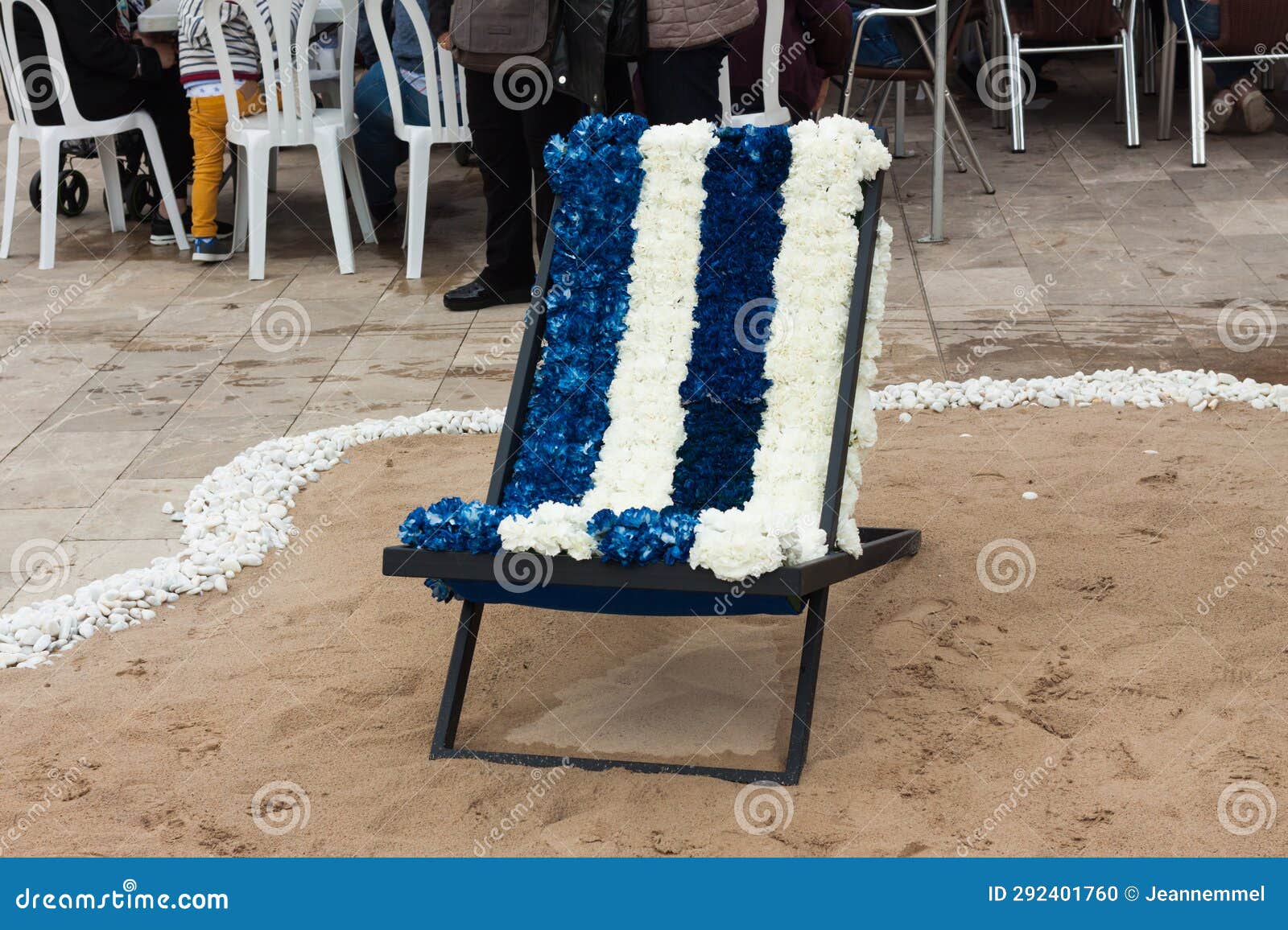 sunbed, decorated with blue and white flowers, on 
