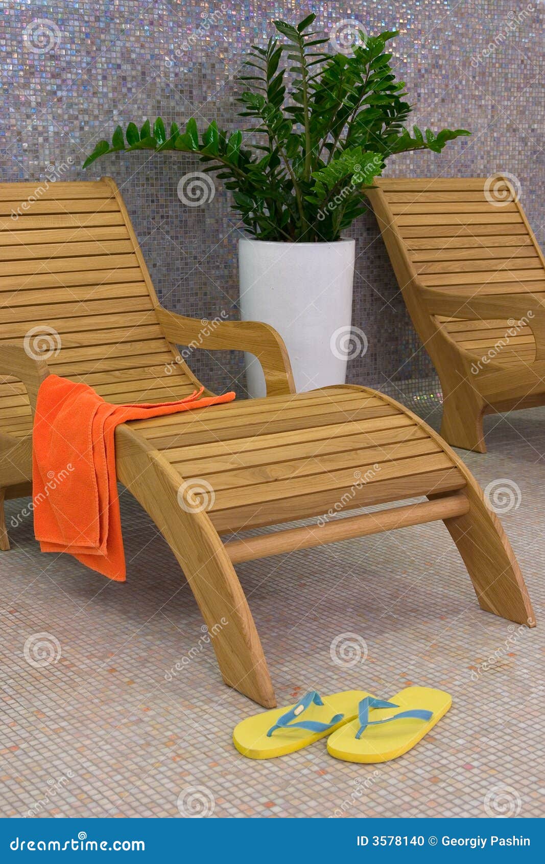 sunbed with orange towel