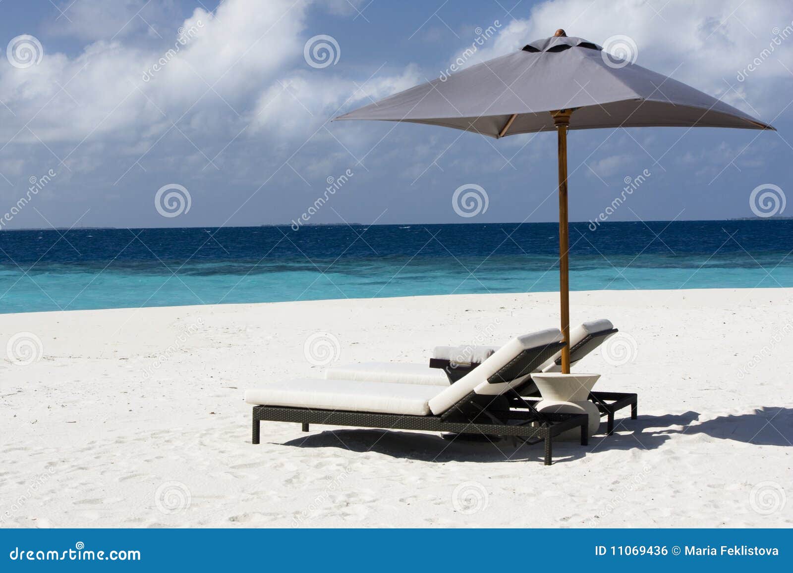 Sunbed on the sandy beach stock photo. Image of horizon 11069436
