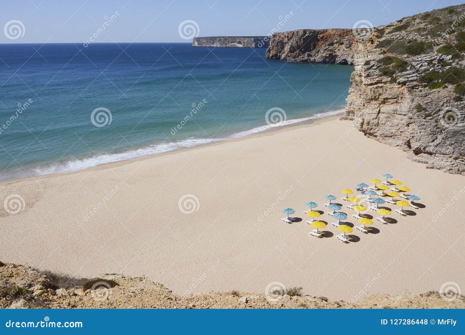 sunbeds on a bautiful beach in algarve, portugal