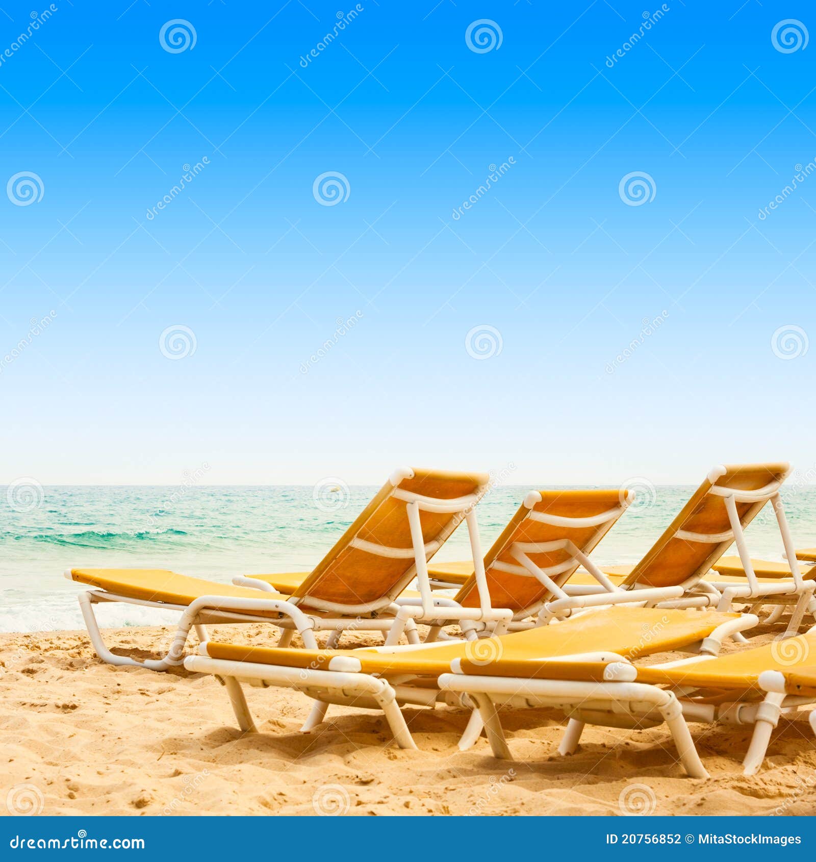 Sunbeds on the sandy beach stock photo. Image of summer 20756852