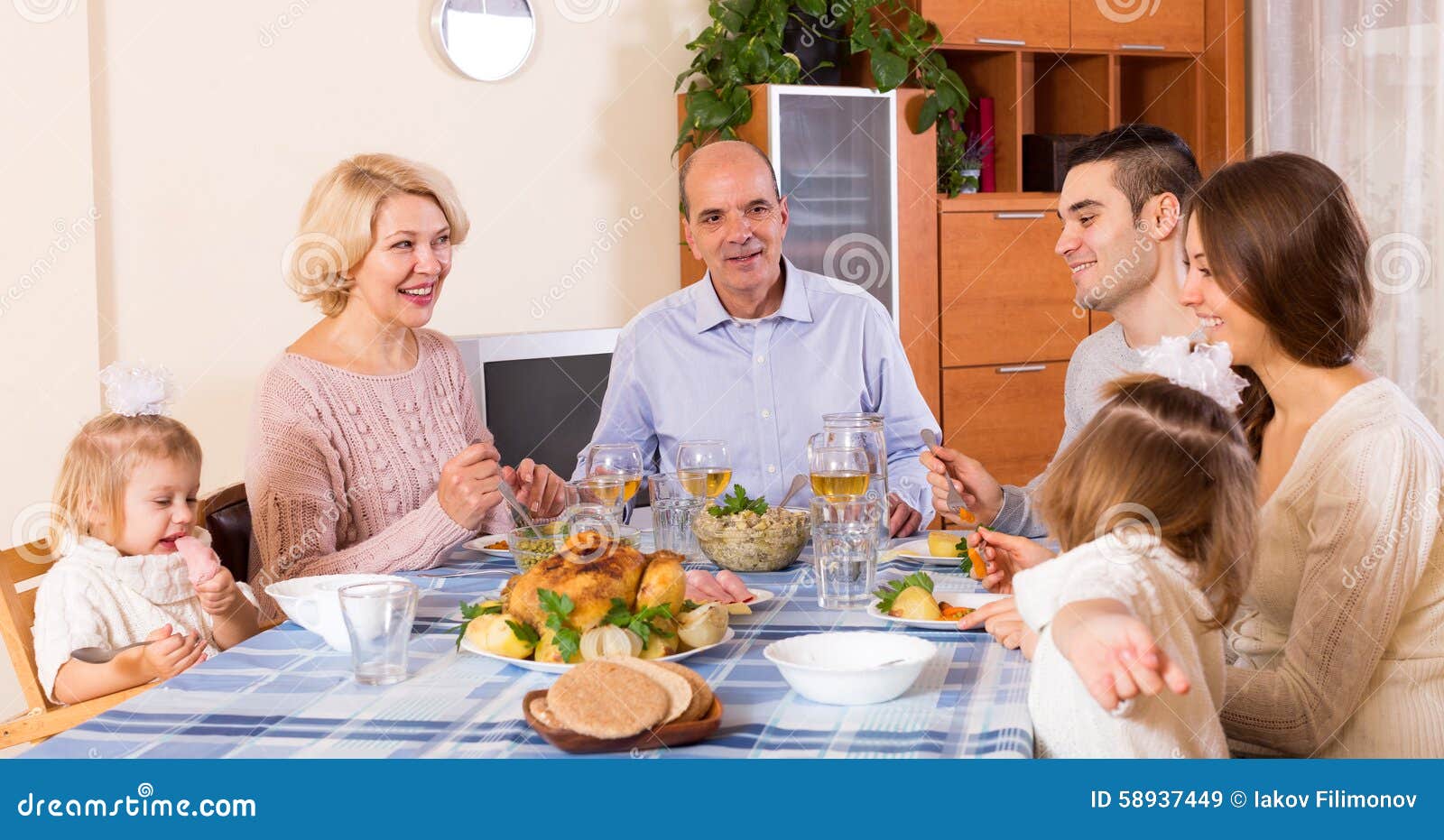 Sunday dinner of family stock image. Image of father - 58937449