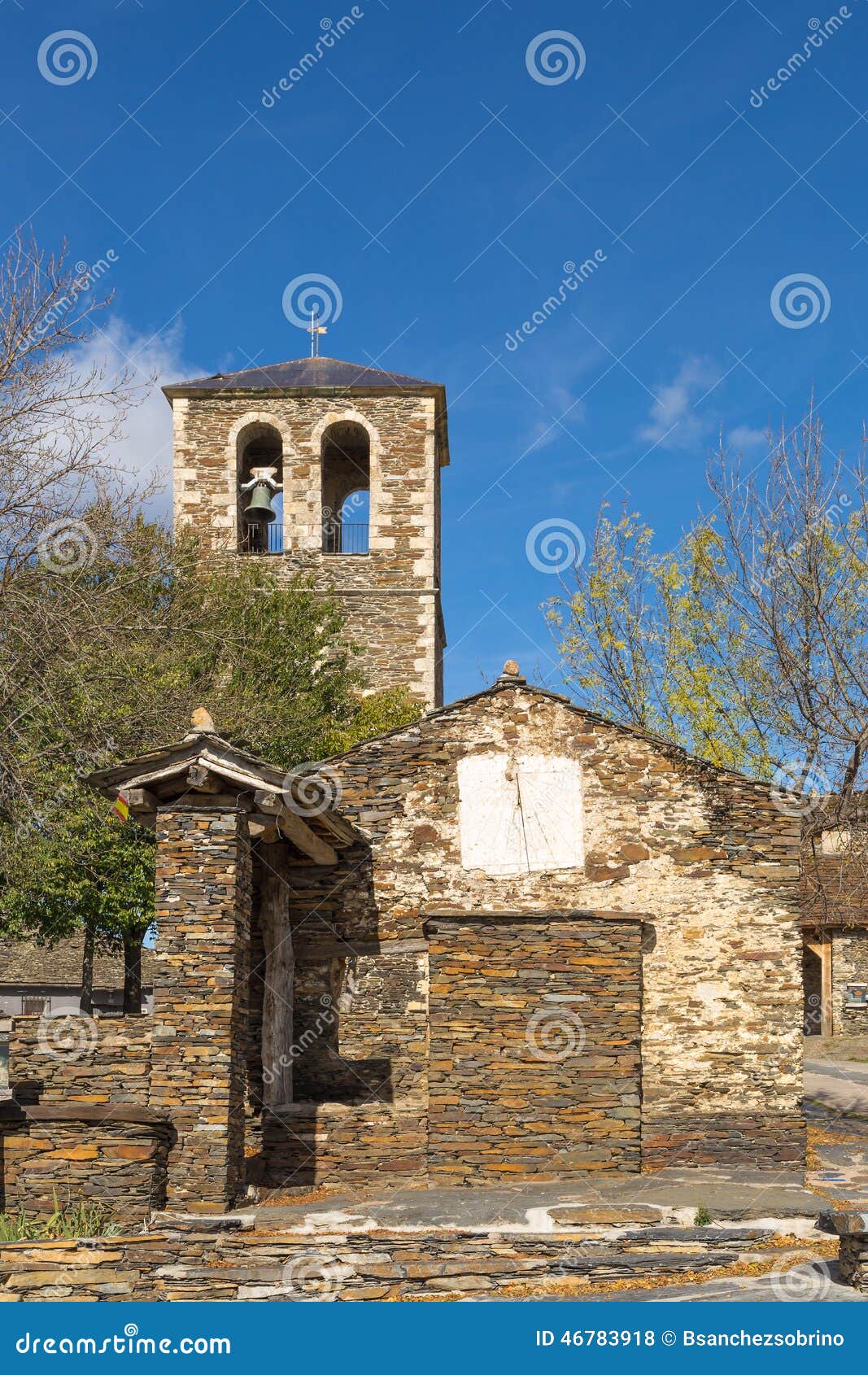 Sundial and church tower stock photo. Image of village 46783918
