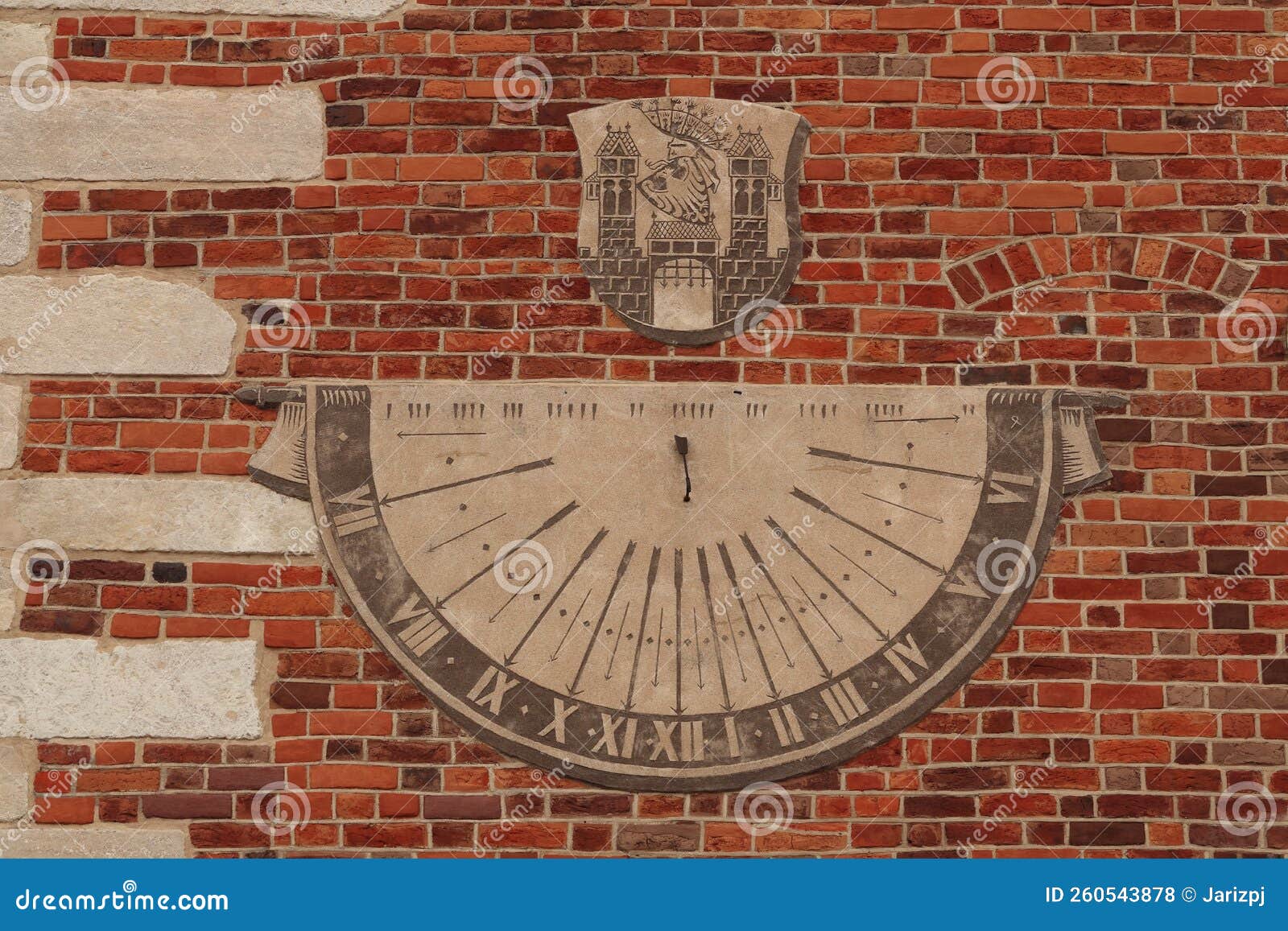 a sundial placed on the wall. sandomierz