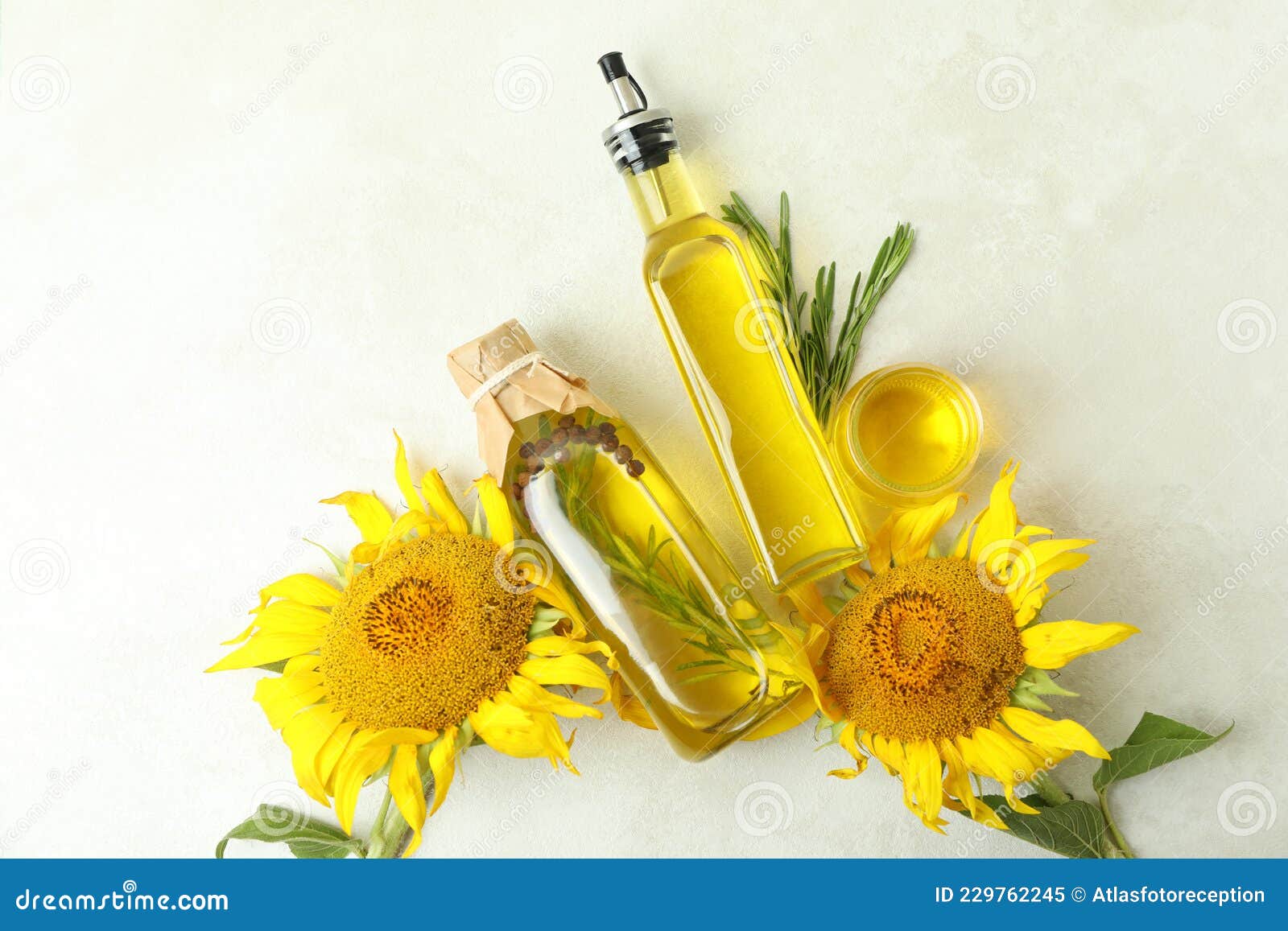 Sunflower Oil and Ingredients on White Textured Table Stock Image