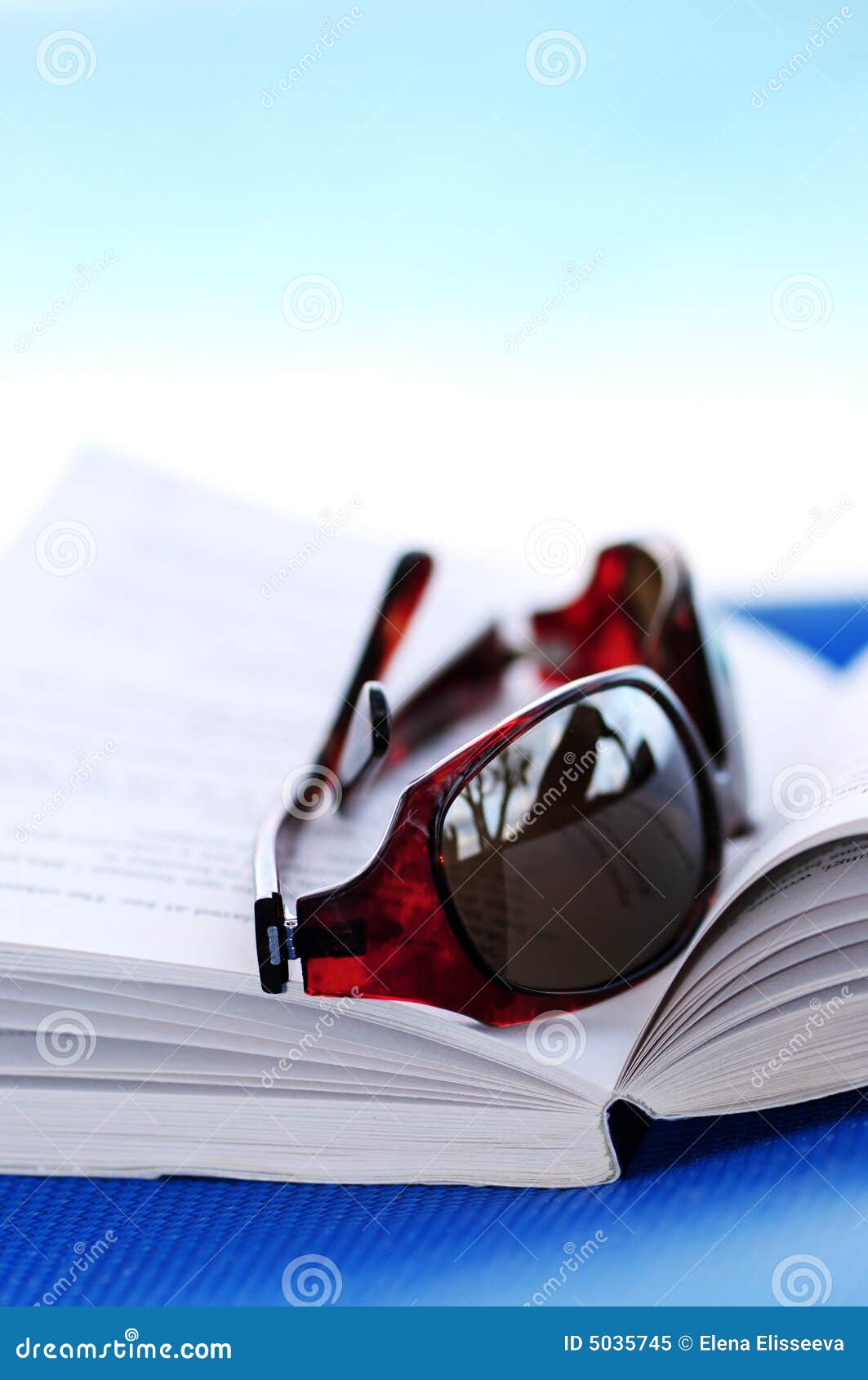 Sunglasses and Book on Beach Chair Stock Image Image of backdrop