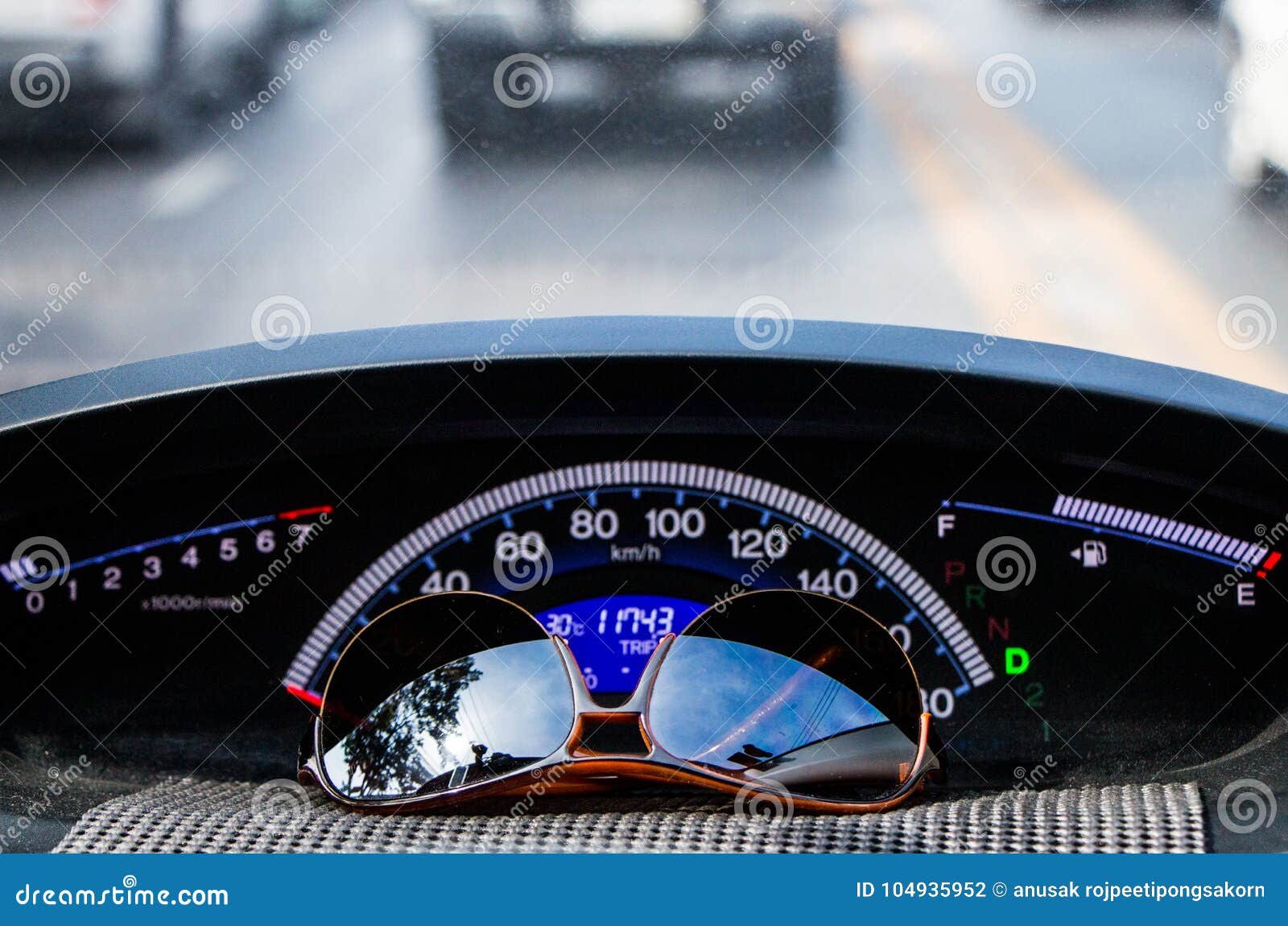 Sunglasses on Car Dashboard Stock Photo Image of odometer, mirror