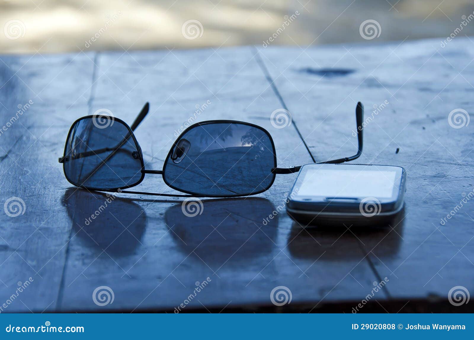 Sunglasses and cell phone stock photo. Image of plastic 29020808