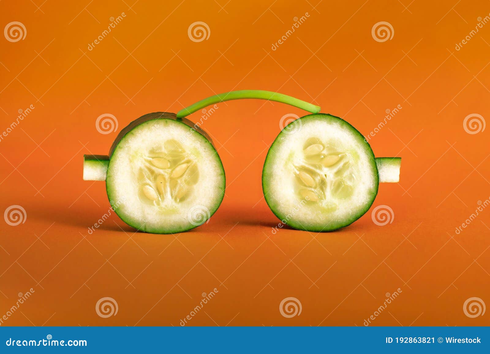 Sunglasses Created With Cucumber On An Orange Background Stock Image