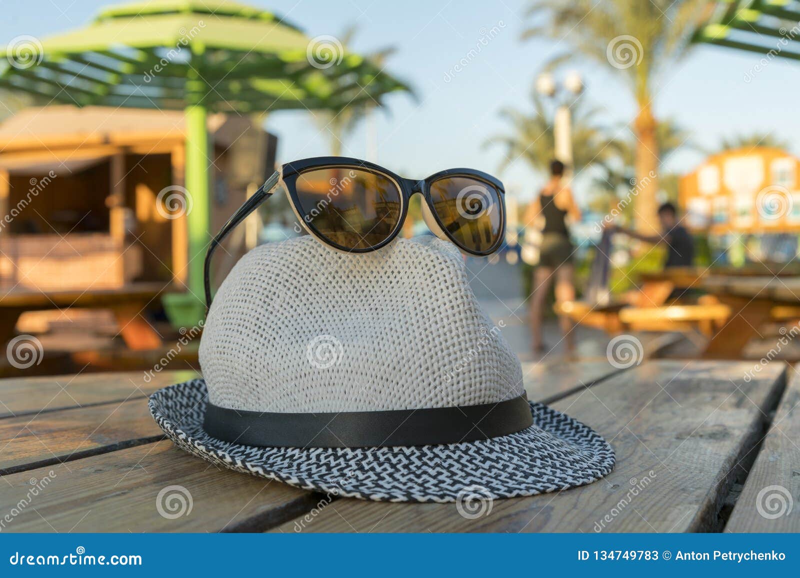 Sunglasses and Hat for the Beach on the Background of Palm Trees ...