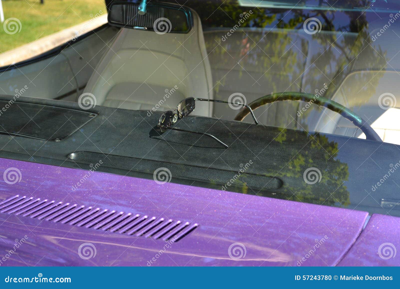 Sunglasses Laying on a Dashboard of a Purple Car Stock Photo Image of