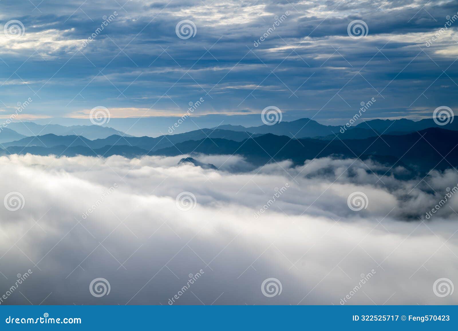 the sunlight makes the sea of clouds change unpredictably, like stormy waves.
