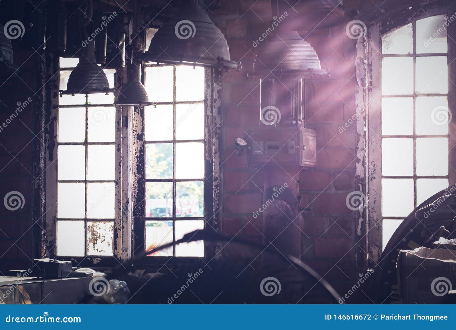 Sunlight Shining through the Windows of an Old Abandoned Industrial