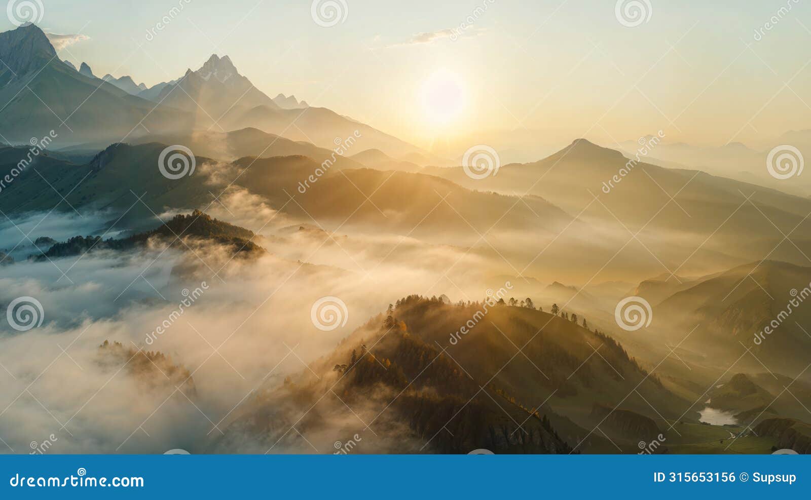 sunlight streaming through clouds on mountainous landscape