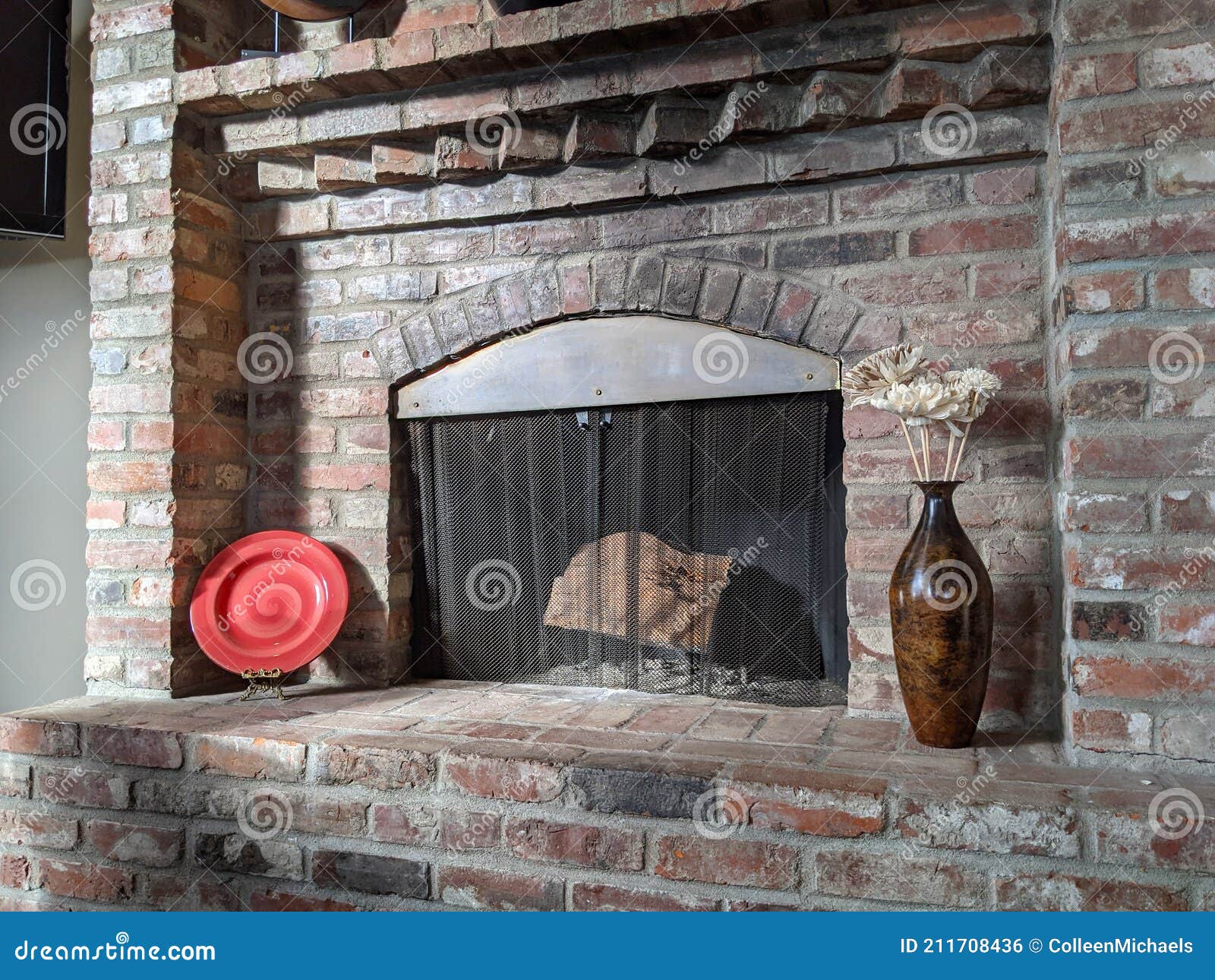 Sunlight Streaming in on a Wood Burning, Brick Fireplace, Surrounded by