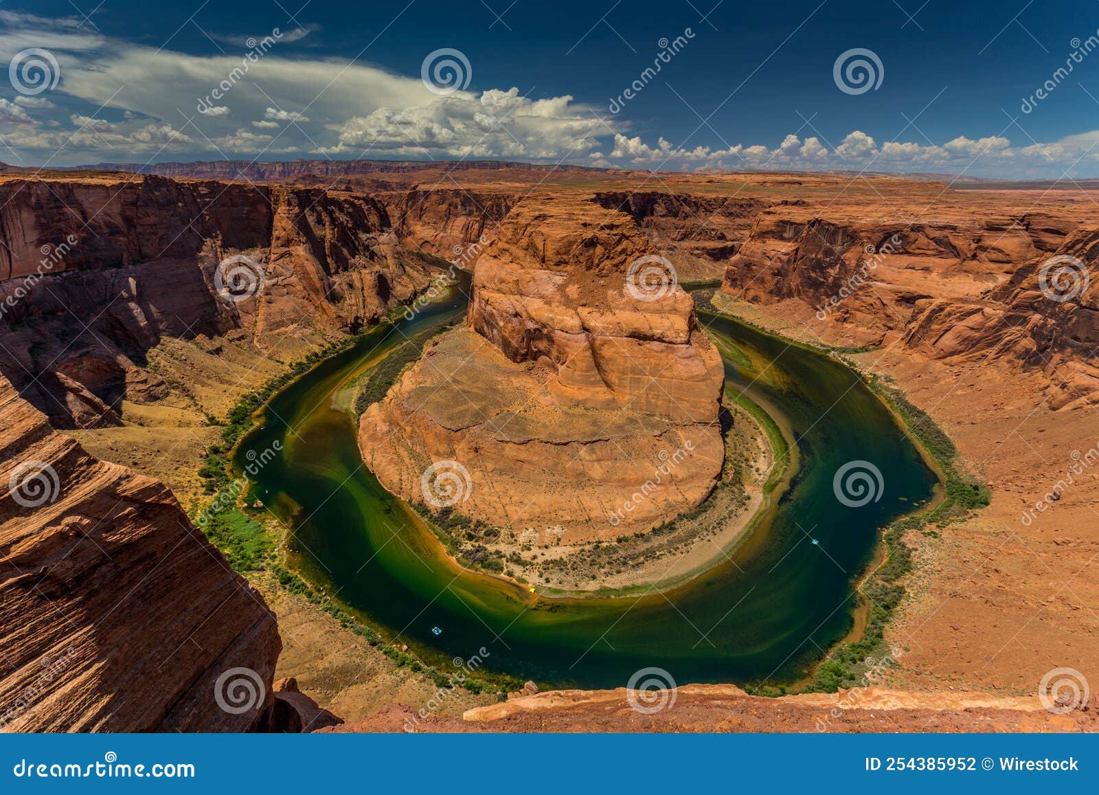 Sunny Day at the Grand Canyon with a River in the Middle Stock Photo