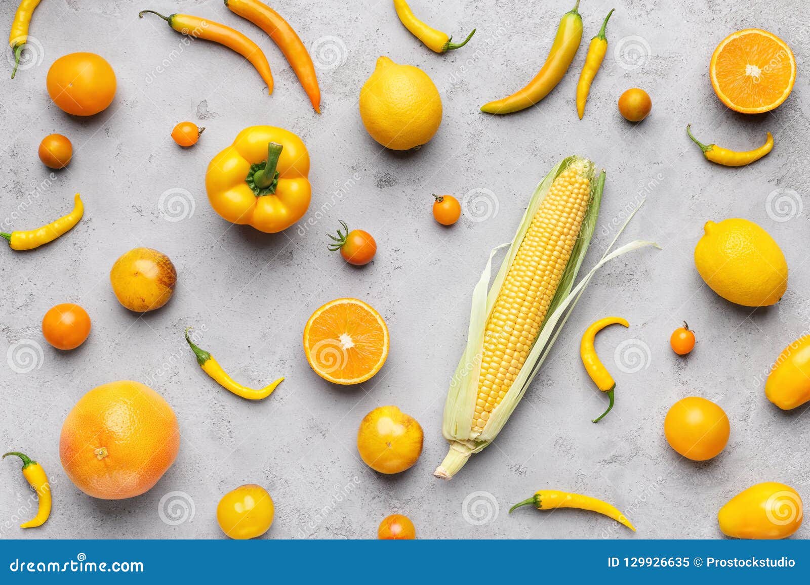 Collection Of Fresh Yellow Fruit And Vegetables On Gray Background ...