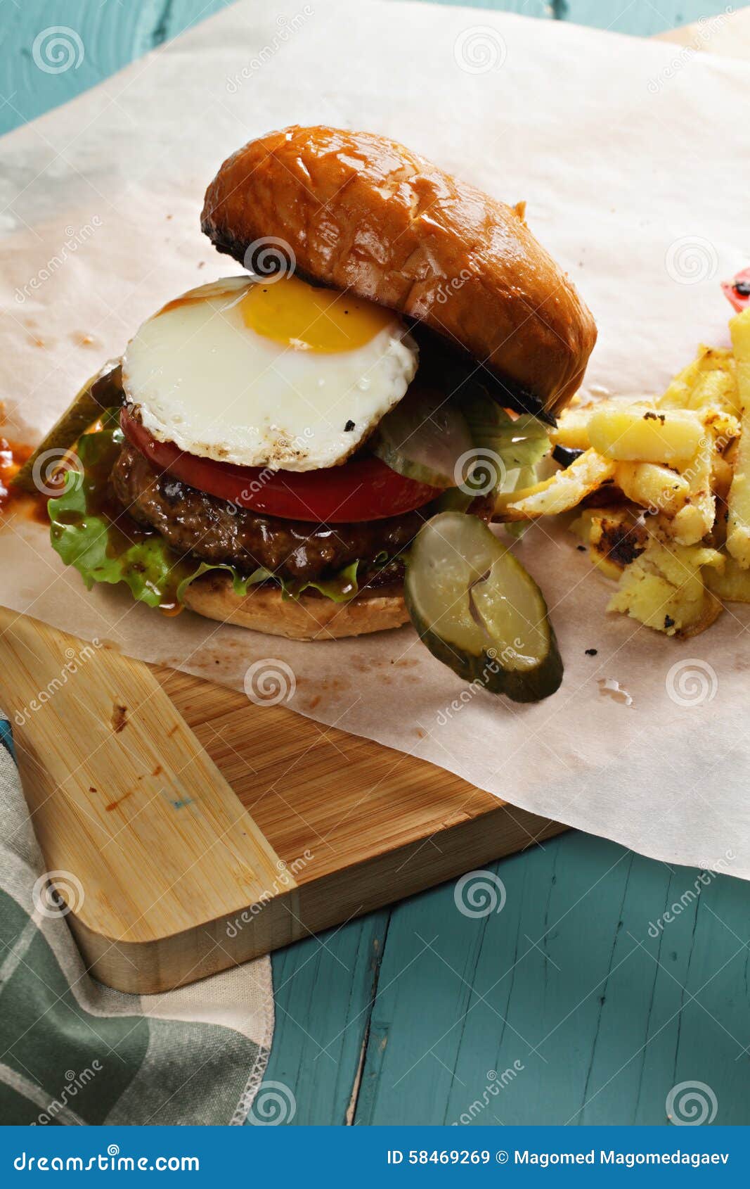 Sunny Side Up Burger on a Wooden Tabletop Stock Image - Image of paper ...
