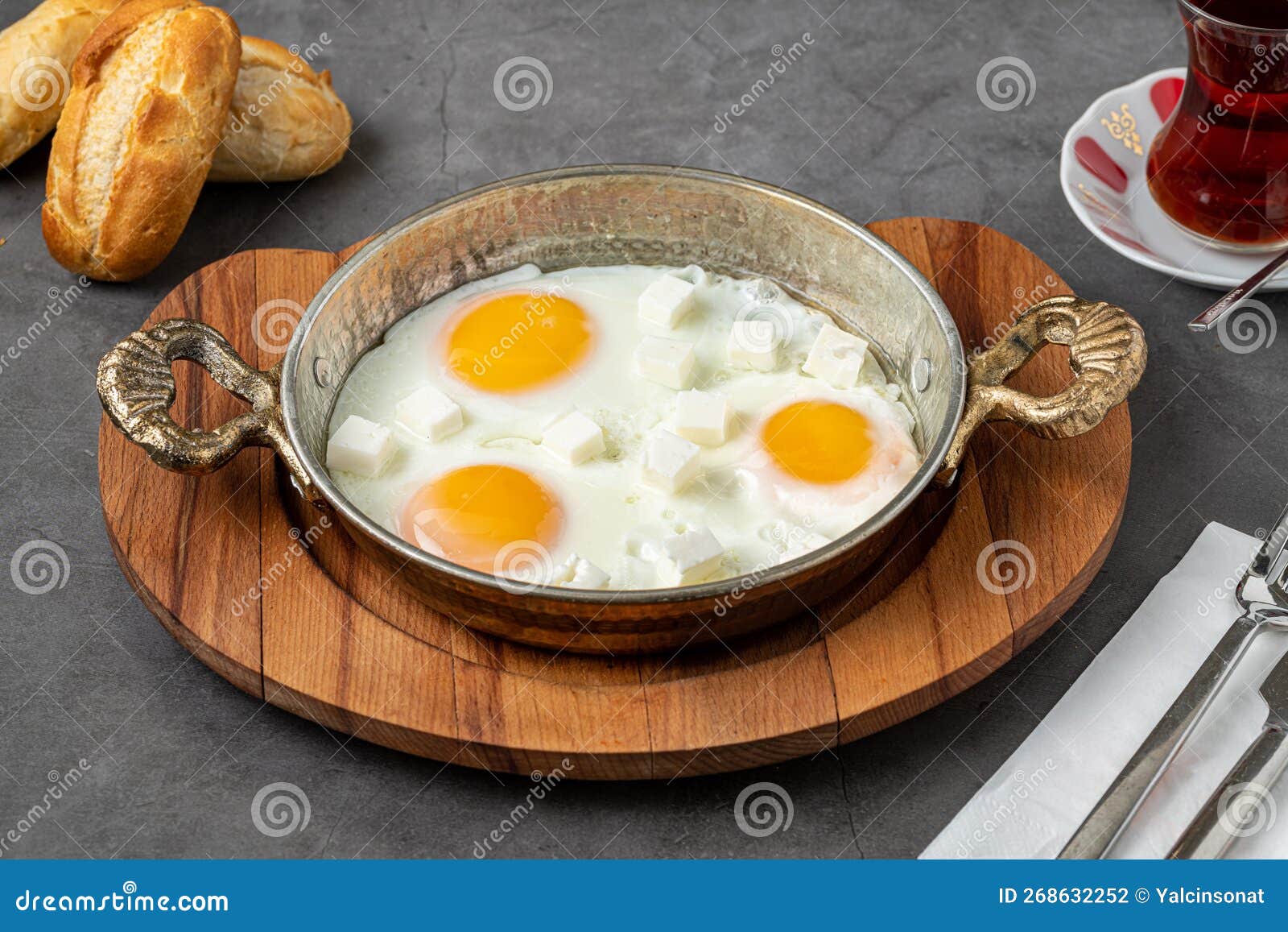 Sunny Side Up Eggs with Feta Cheese in a Copper Pan Stock Photo Image