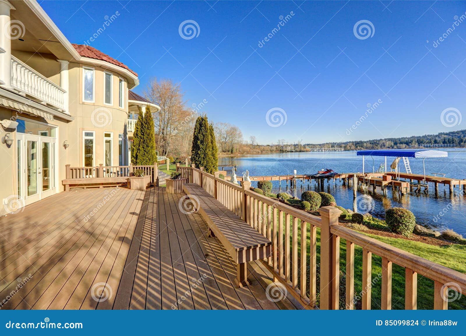 sunny spacious walkout deck of luxurious waterfront home