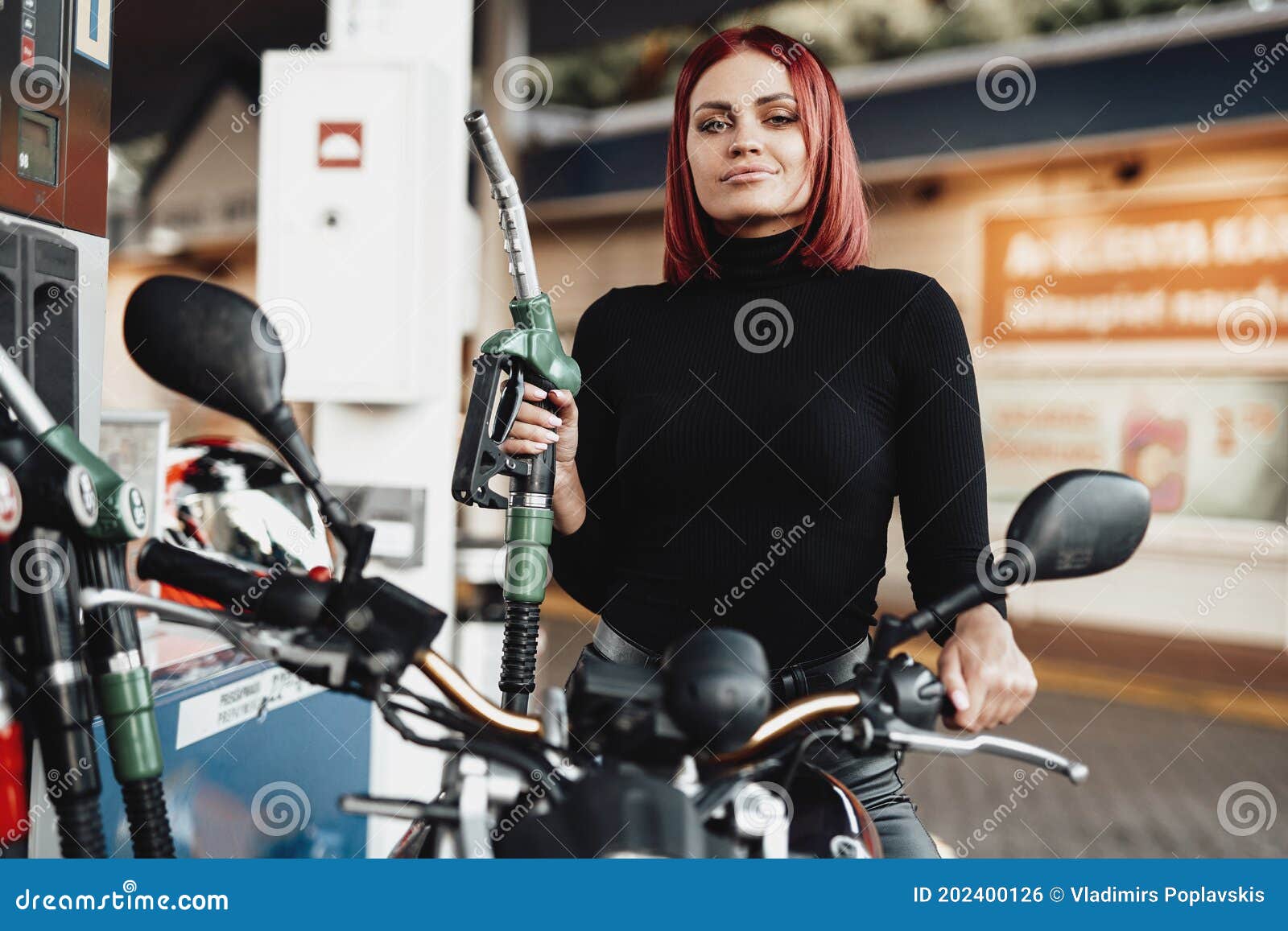 Beauty Young Girl is Sitting on Her Bike in Gas Station Stock Photo - Image  of fashion, cute: 202400126