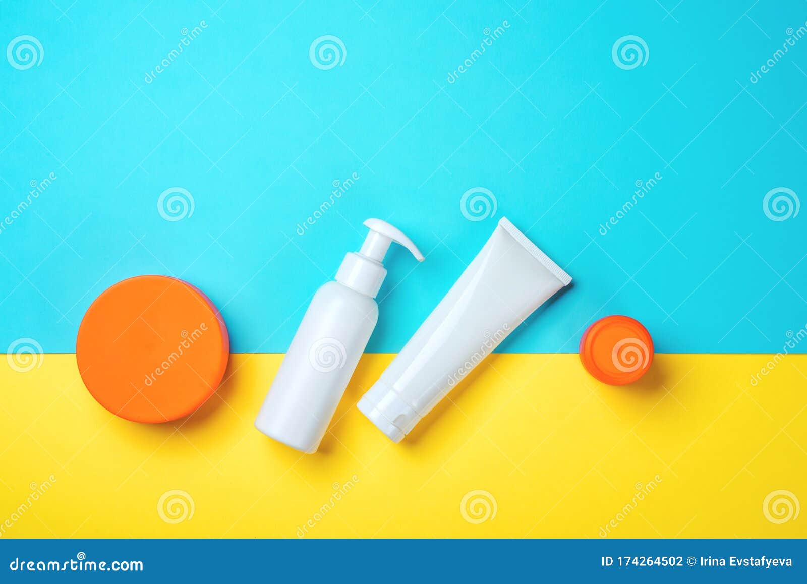sunprotection objects, suscreen. flat lay, natural cosmetics, cream spf for face and body. summer travel concept