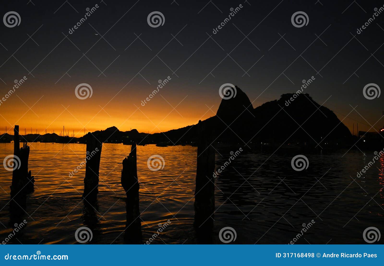 sunrise on botafogo beach next to sugarloaf mountain, traditional postcard of brazil