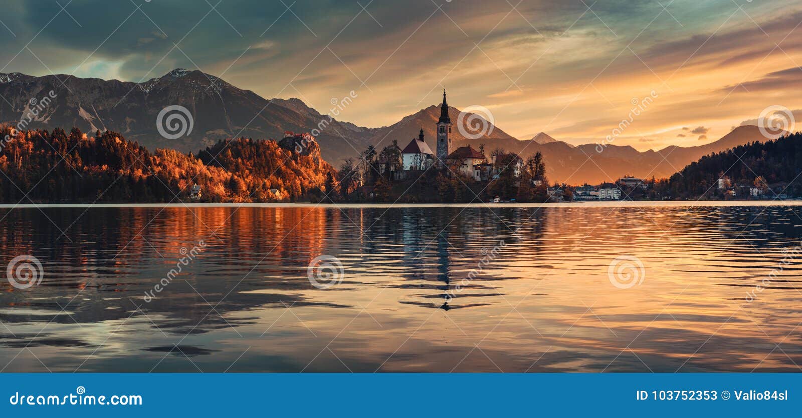 sunrise over lake bled with st. marys church of the assumption on the small i