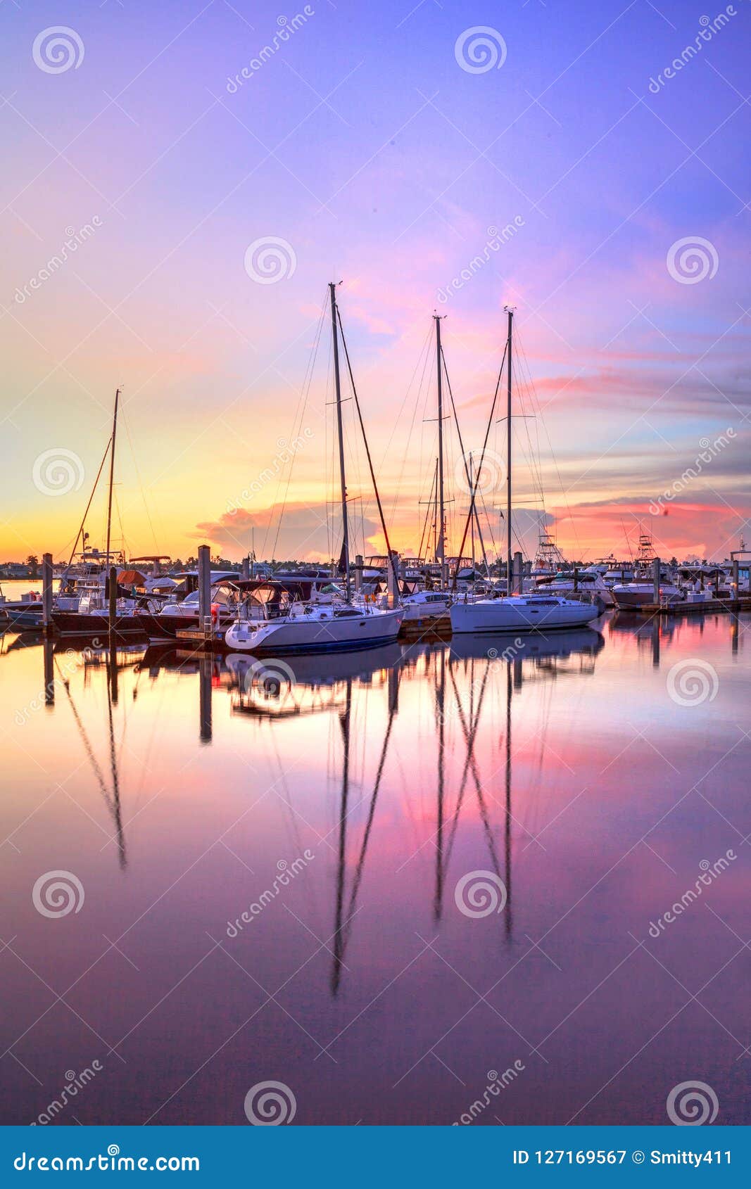sunrise over a quiet harbor in old naples, florida