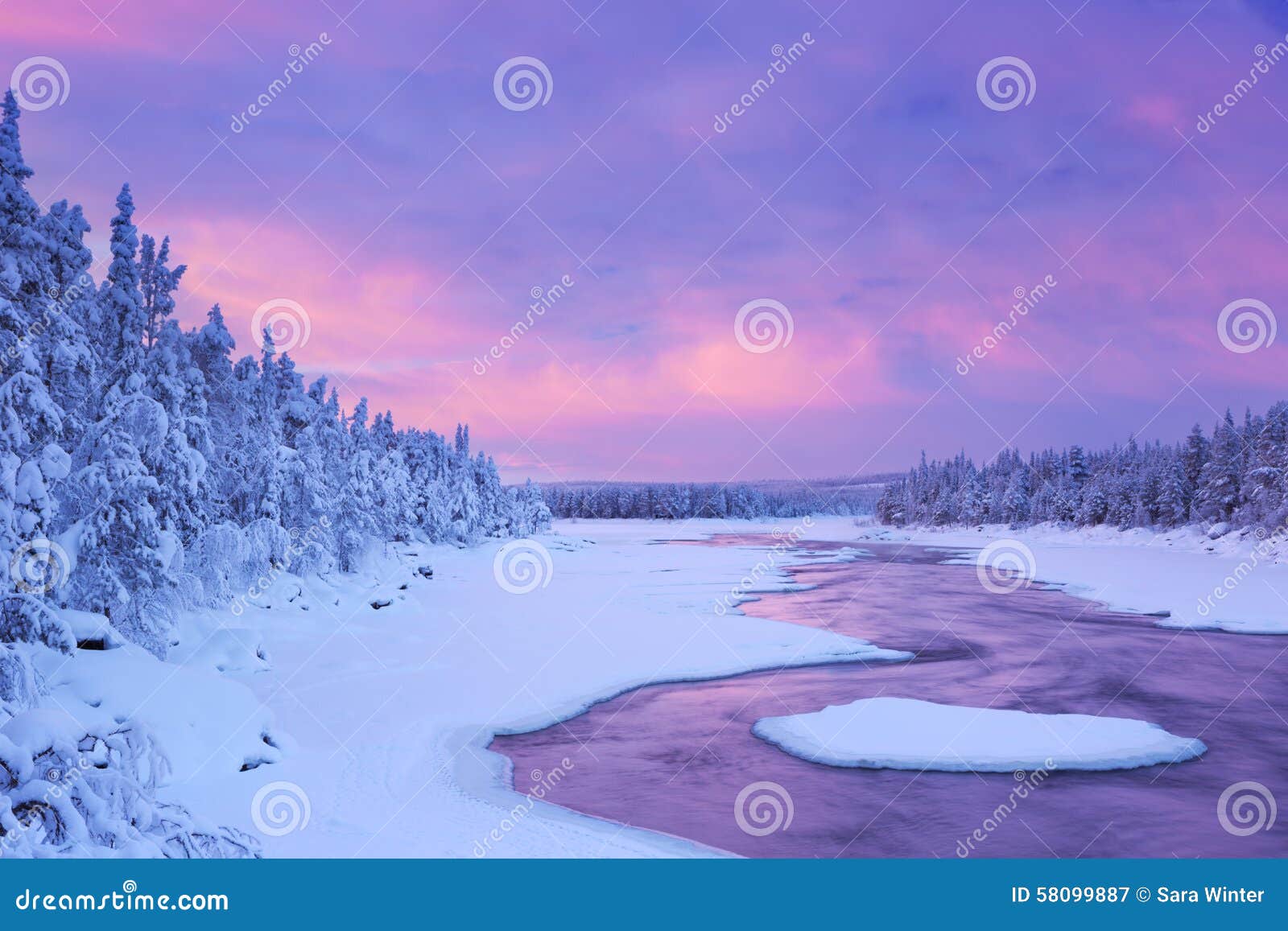 sunrise over river rapids in a winter, finnish lapland