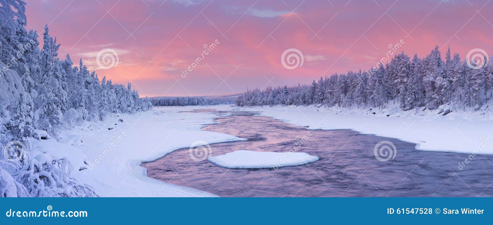 sunrise over a river in a winter landscape, finnish lapland