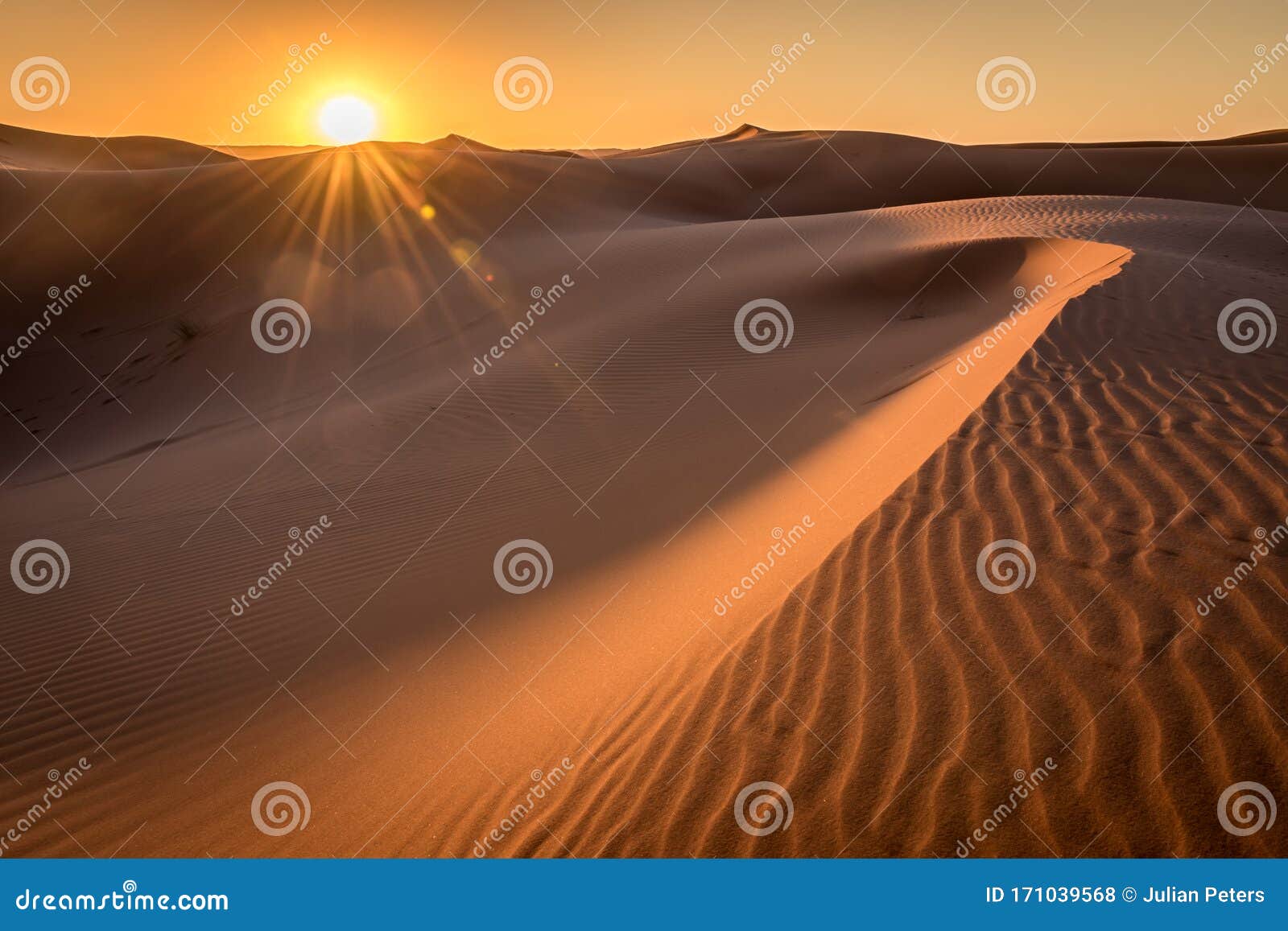 sunrise over the sahara dunes, merzouga, morocco