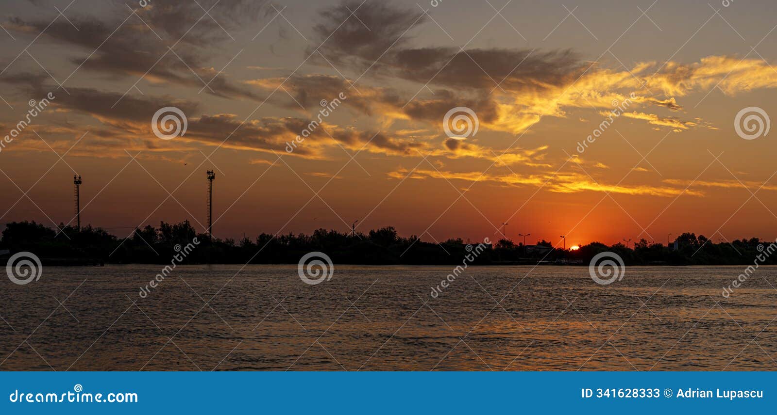 sunrise over sulina town in the danube delta