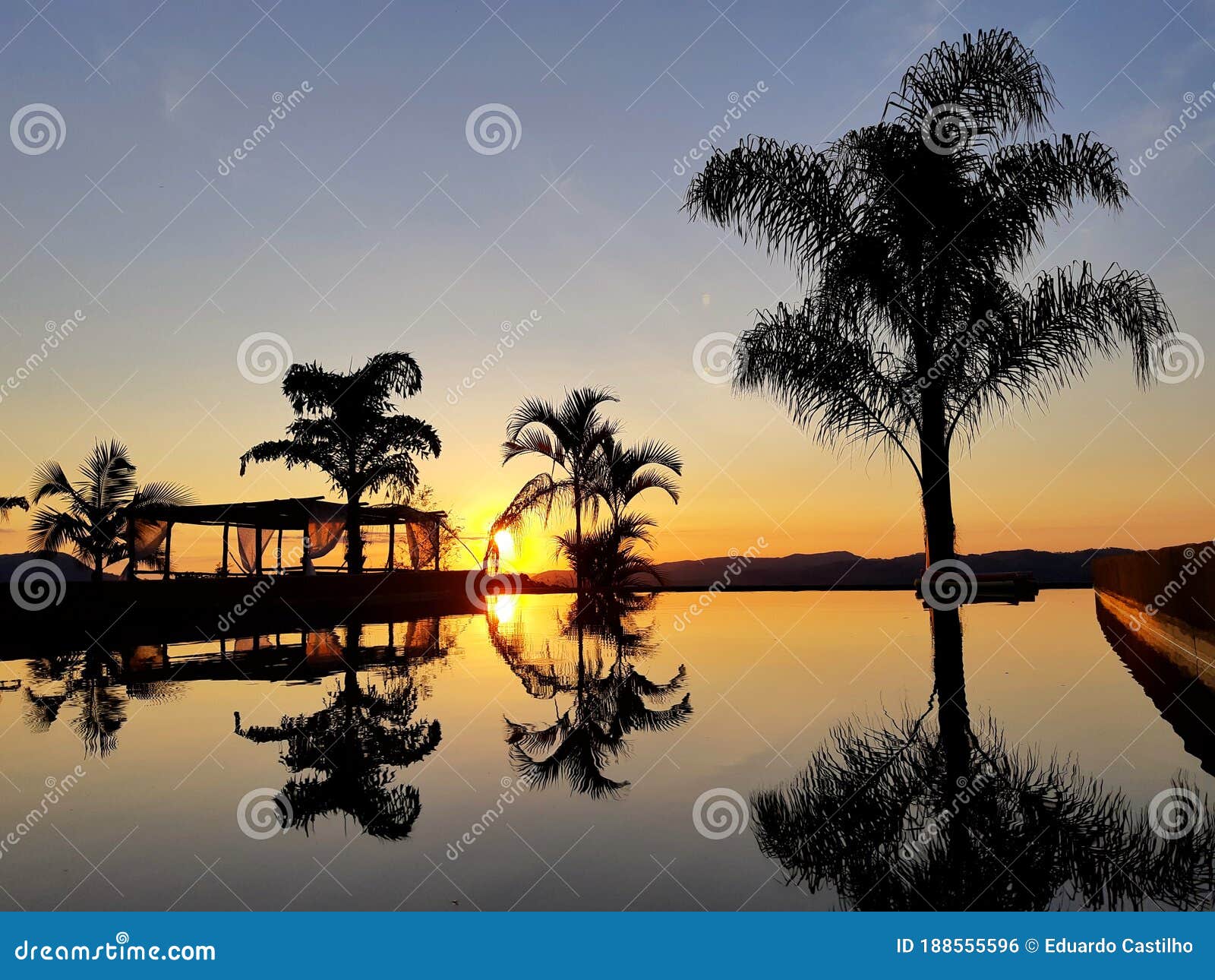 sunrise, palms and bungalow view in senador josÃÂ© bento, minas gerais, brazil. 01/jan/2020