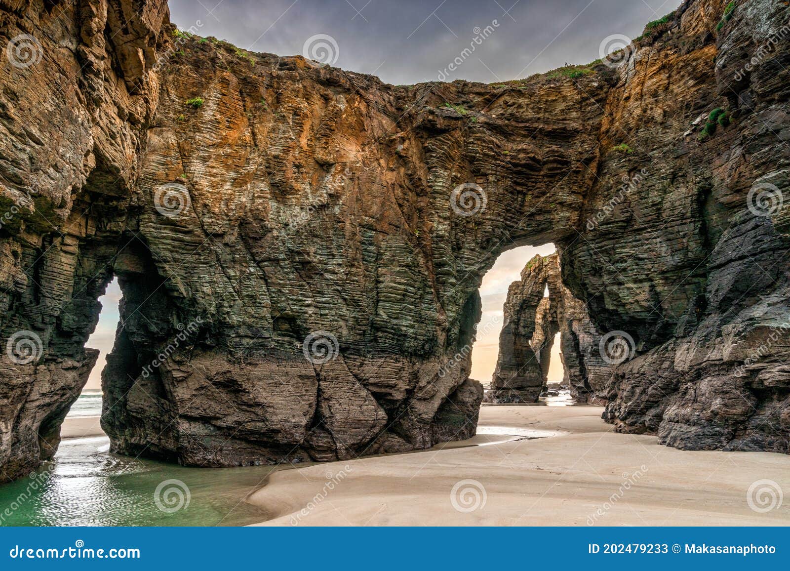 sunrise at the playa de las catedrales beach in galicia in northern spain