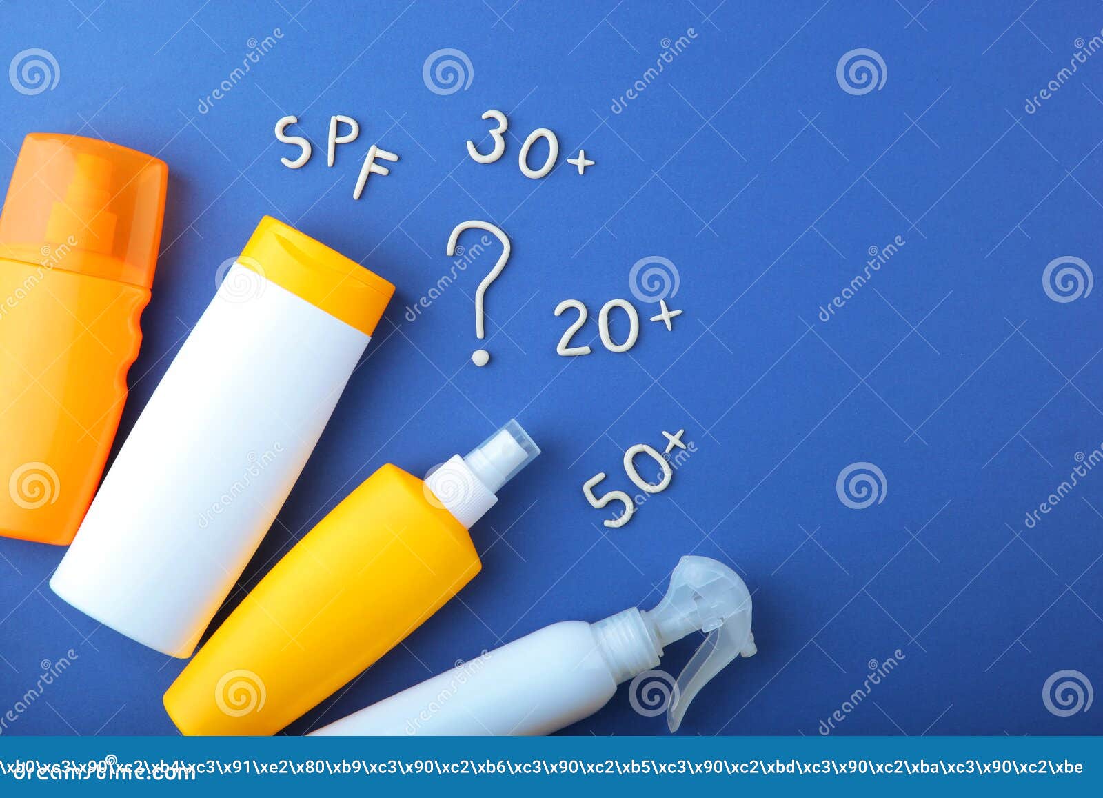 sunscreens on a colored background top view.