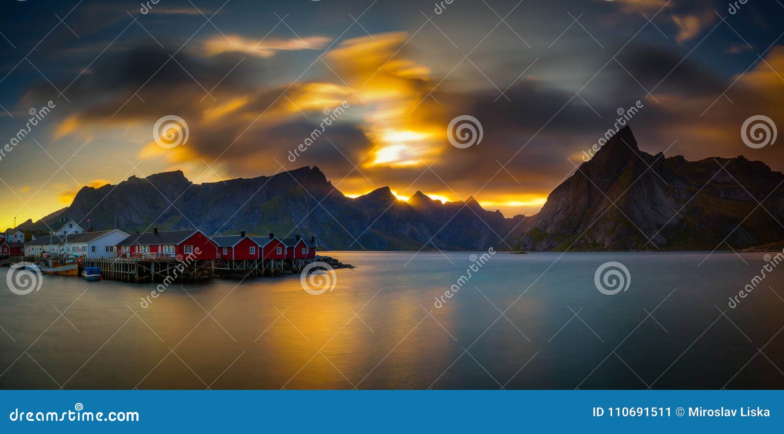 sunset above mount olstind and the village of hamnoy in norway