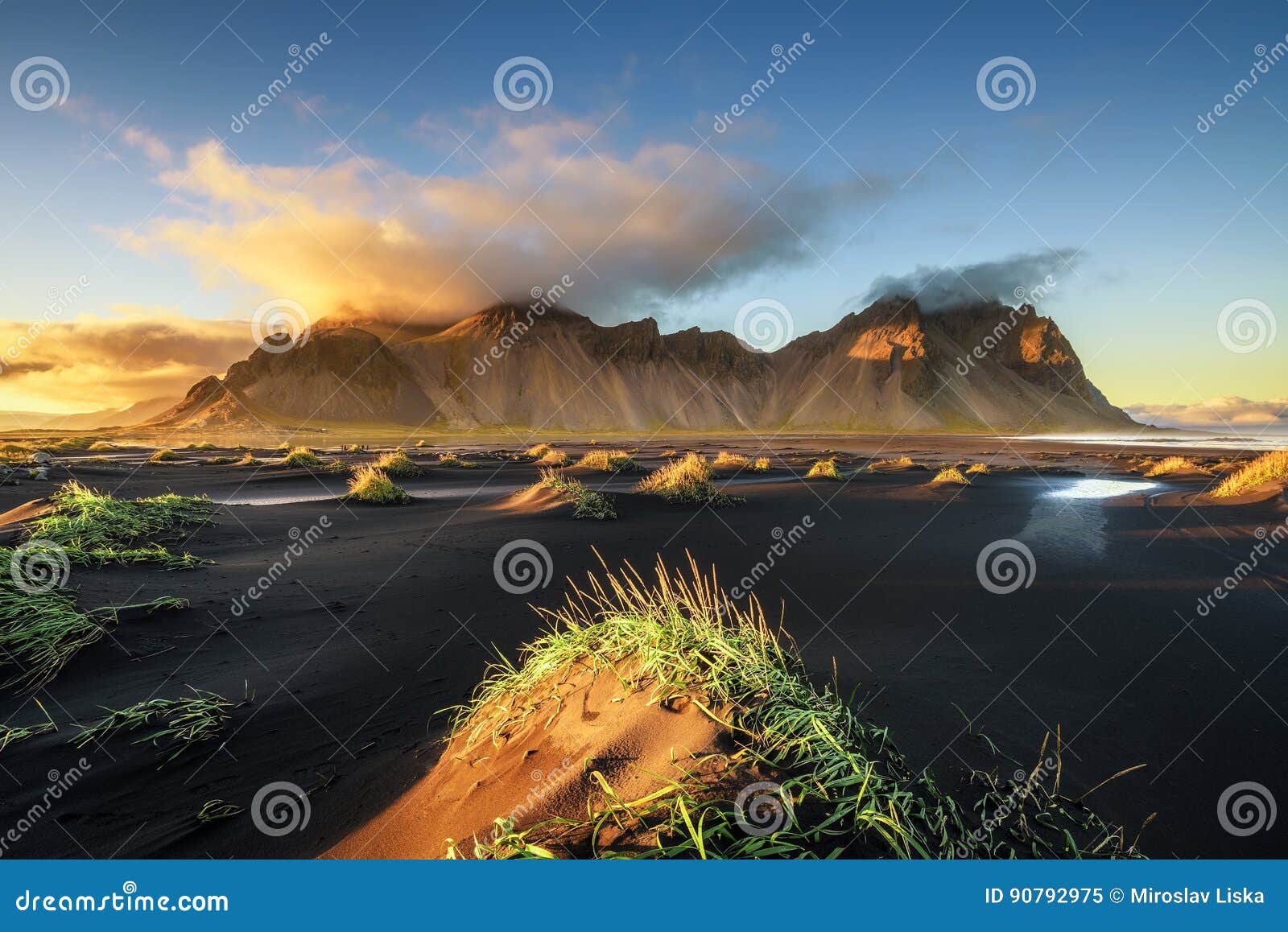sunset above vestrahorn and its black sand beach in iceland