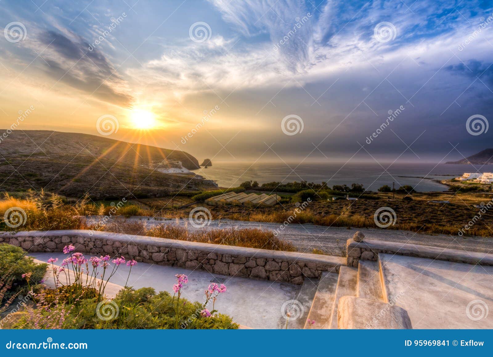 sunset at apollonia & x28;& x27;polonia& x27;& x29; village in milos, greece