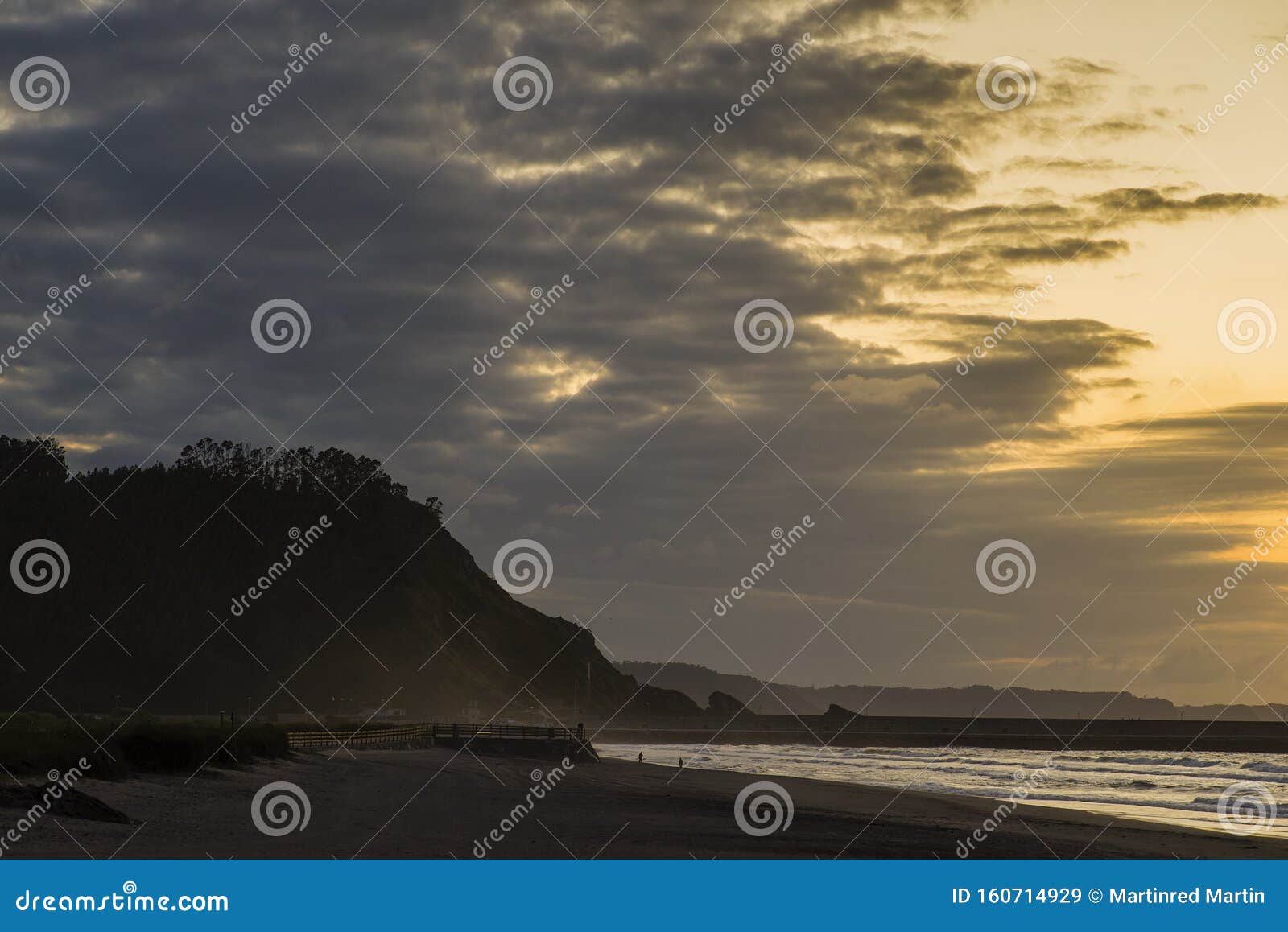 sunset on asturias beach. clouds over the cantabrian sea