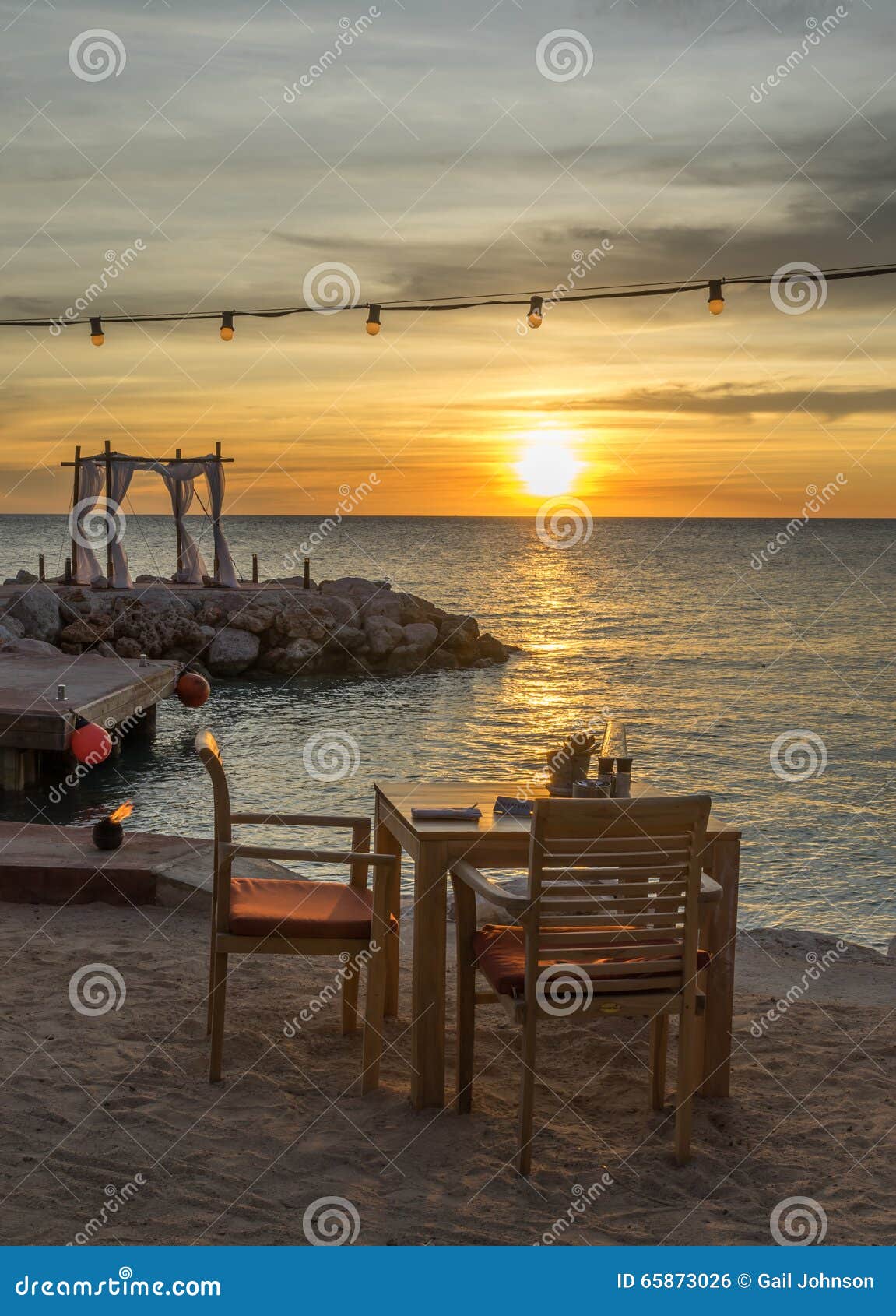 Sunset at the beach cafe stock photo. Image of wedding - 65873026